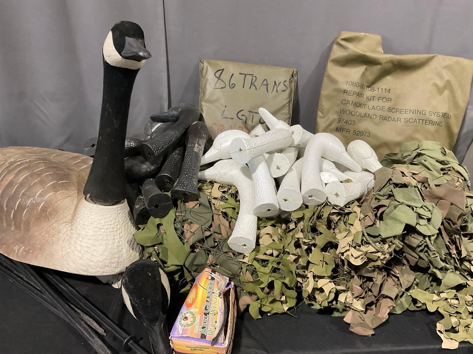 Camouflage Screen, Many Duck Head Decoys w/Stakes, & cloth covers, box full, uncounted (1 of 7)