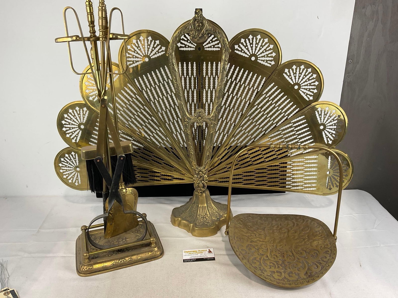 Cast Brass Fireplace Folding Screen, Log Holder, & Set of Tools, Poker, Large Tongs, Brush & Shovel: Appears to be in good shape. The piece measures approx 30h x 20w x 13d inches. See pics. E-5830