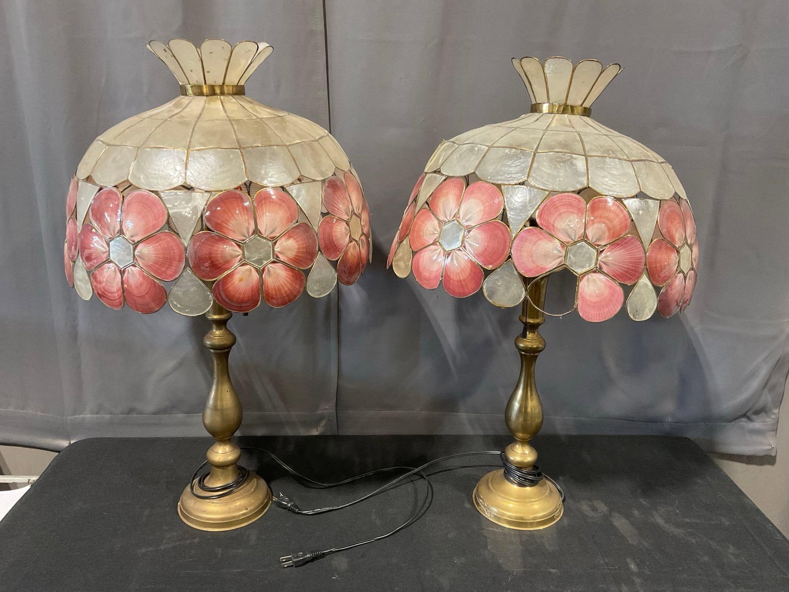 Pair of Brass Tiffany-style Lamps, Pink & White Capiz Seashell Shades, both tested, needs repairs: *No in-house shipping, fragile and oversized* Many fractures, or missing pieces, the shades are loose from the supports at the top. Needs some TLC. Appears to be in fair shape. The lamps are