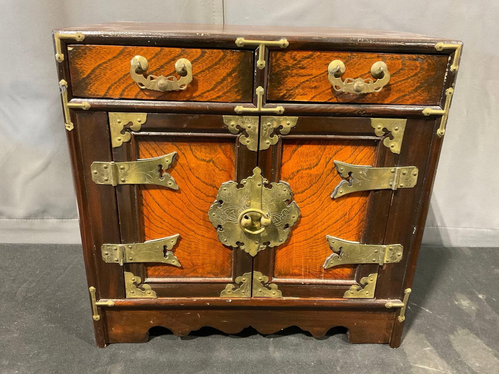 Small Asian Brass Banded Cabinet, 16h x 16w x 11d inches, 2 small drawers & latching doors: Appears to be in good shape. The piece measures approx 16h x 16w x 11d inches. See pics. E-5830