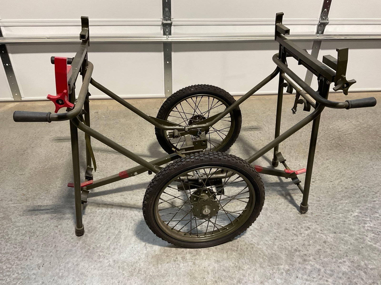 US Army Wheeled Litter, Folding, roughly 35-40 pounds, Olive Drab in color: Appears to be in good shape. The piece measures approx 36h x 25w x 25d inches. See pics. E-5600 *Freight Required if shipped, Buyer Arranged/Responsibility*