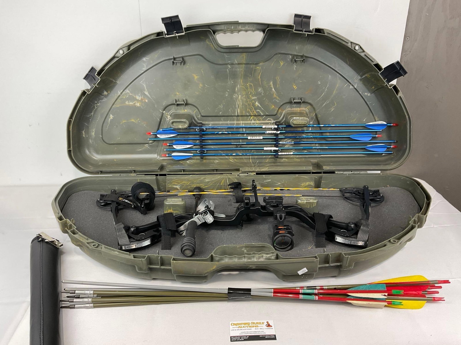 Diamond by BowTech Compound Bow, in Plano Bow Case, assortment of 12 arrows, 20h x 42w x 8d inches: Seems to be set to about 30-40 pounds currently, the weight is adjustable to 7-70 pounds. Appears to be in good shape. The piece measures approx 20h x 42w x 8d inches. See pics. E-1554 *Freight