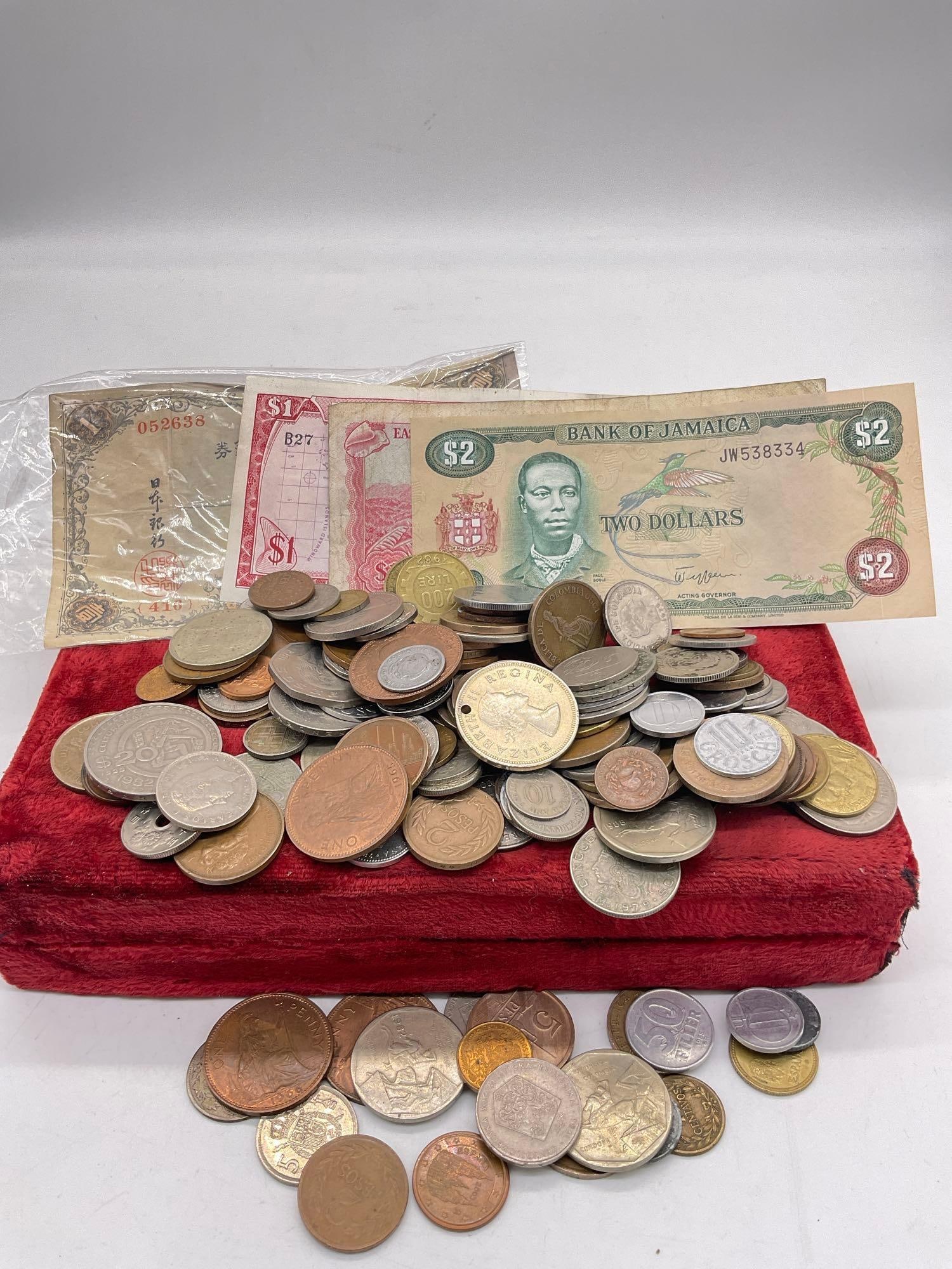 Large selection of foreign Currency and coins from around the world. (1 of 5)