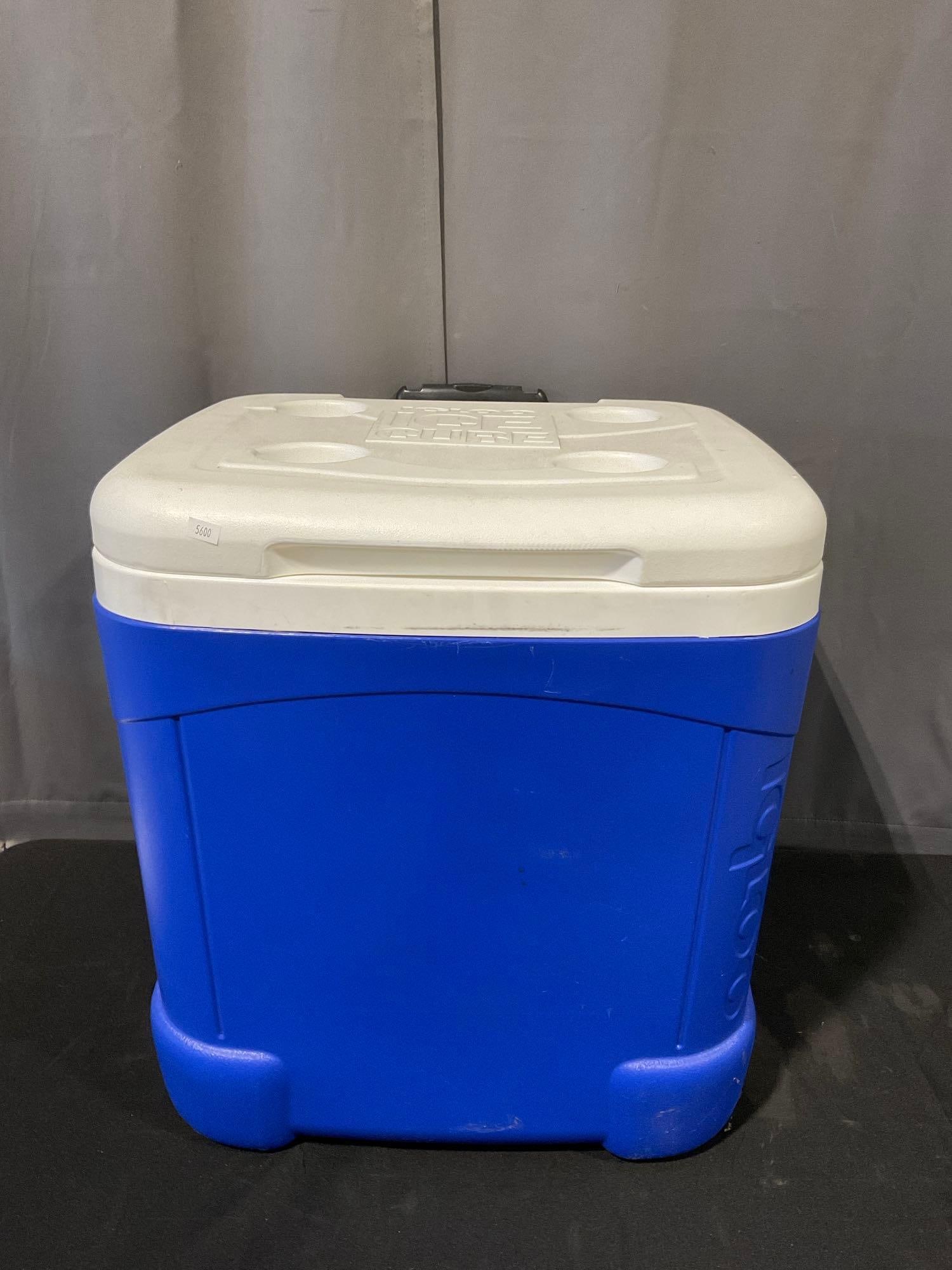 Igloo Ice Cube Chest Cooler, Blue & White, 60 quart size, 22h x 19w x 20d inches: Appears to be in good shape. The piece measures approx 22h x 19w x 20d inches. See pics. E-5600