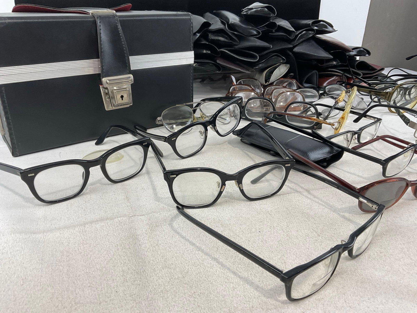 roughly 32 pairs of Glasses, w/cases, variety of prescriptions, & leather case - 2