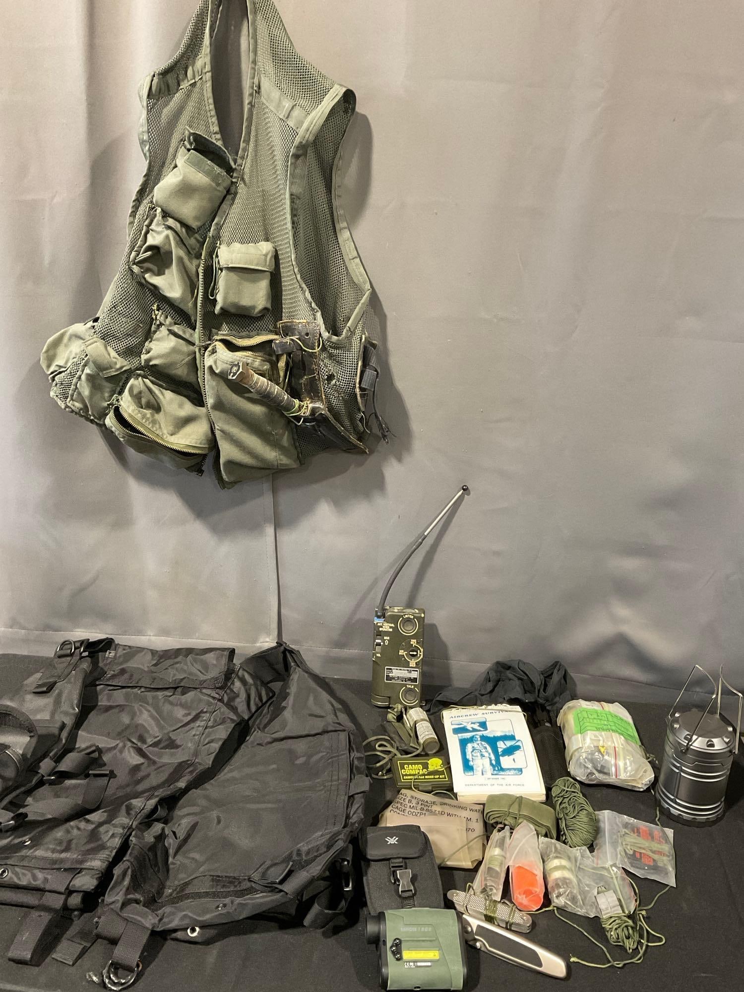 2 Tactical Vests, Vortex Ranger Rangefinder & Kershaw Folding Knife, & more Survival supplies: Appears to be in good shape. The piece measures approx 17h x 17w x 8d inches. See pics. E-5600