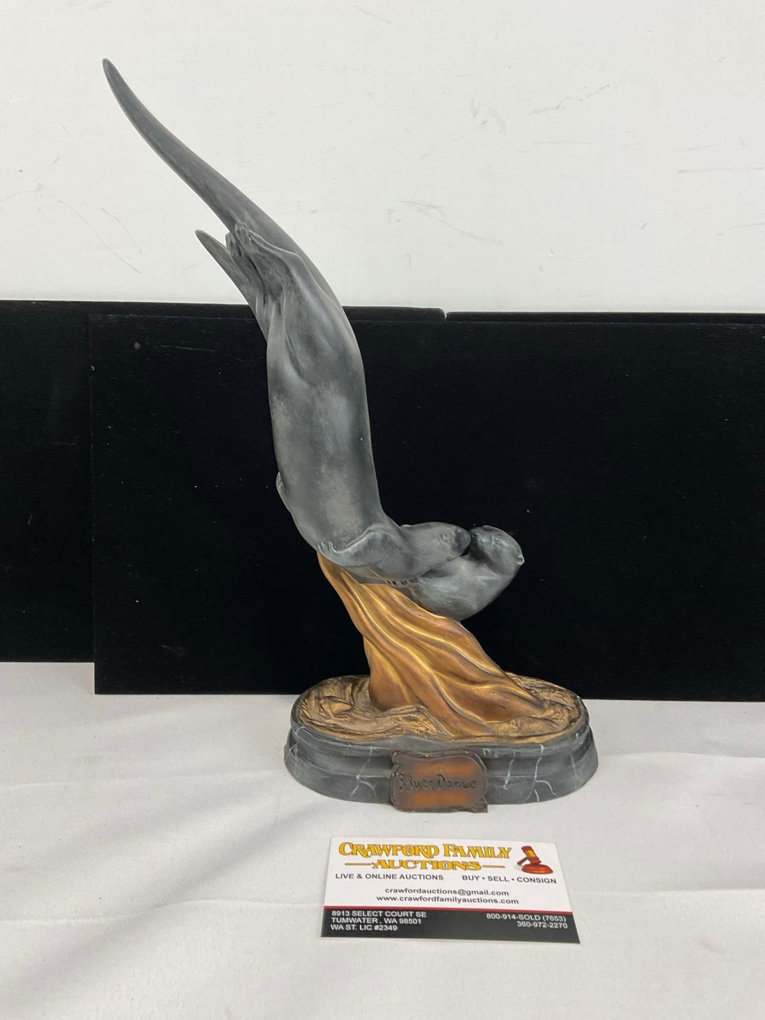 Pair of Otters, Sculpture Big Sky Carvers titled River Dance by Clark Schreibers, Signed by artist: Appears to be in good shape. The piece measures approx 14h x 8w x 5d inches. See pics. E-5860