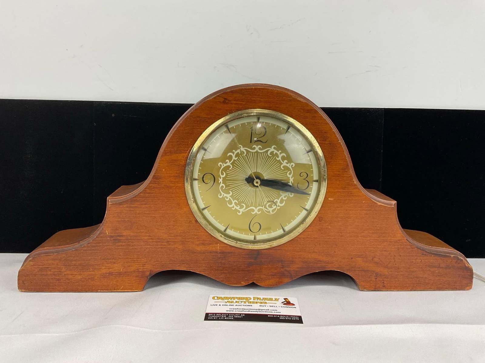 Wooden Camelback Mantel Lanshire Clock, Electric, 10x20 inches: Appears to be in fair to good shape, needs some TLC. The piece measures approx 10h x 20w x 4d inches. See pics. E-5860