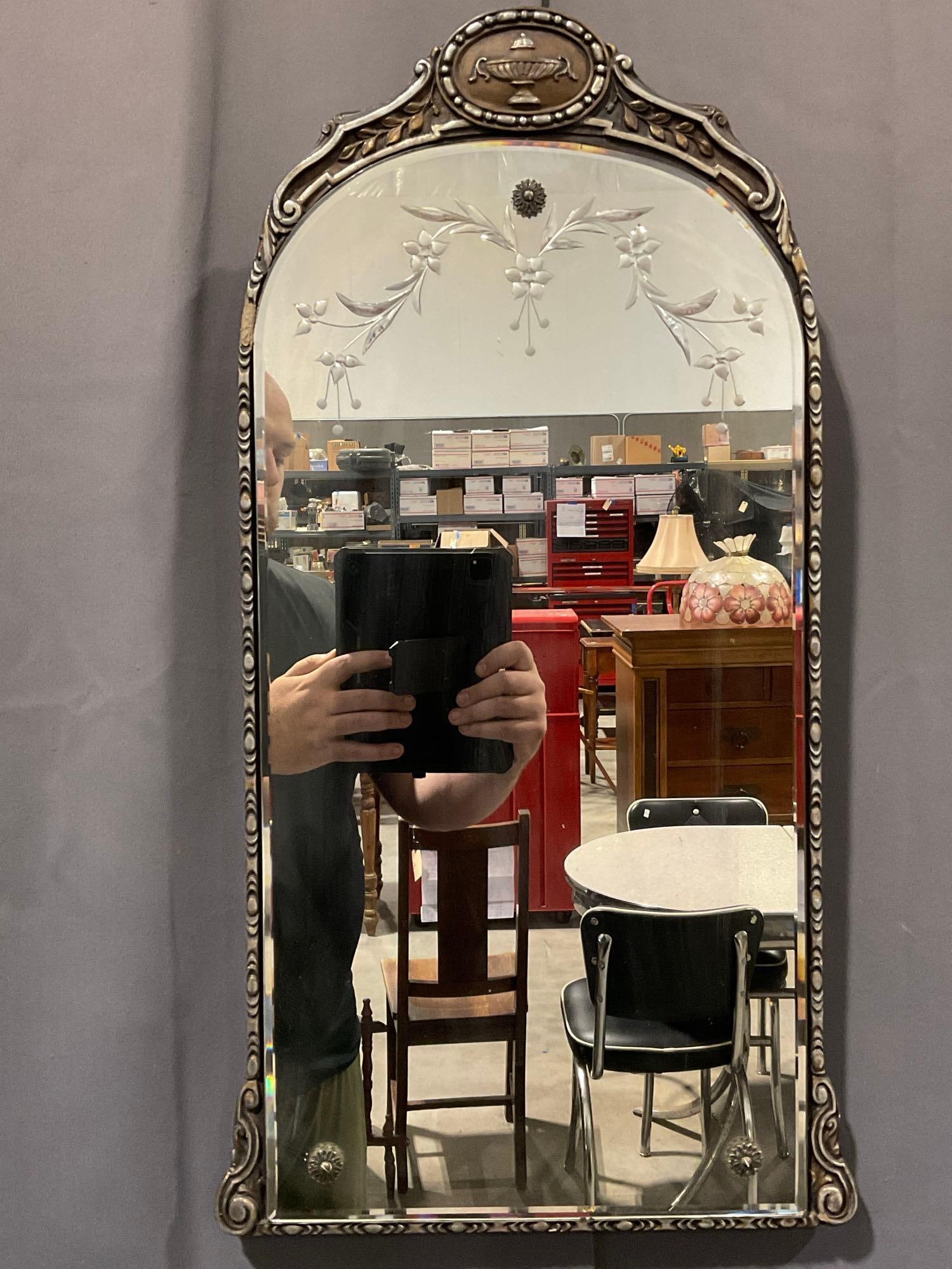 Framed Etched Ornate Mirror, 28h x 15w x 4d inches: Looks like metallic finish on wood or plastic frame. Appears to be in fair to good shape, some wear along the frame. The piece measures approx 28h x 15w x 4d inches. See pics. E-5860 *Oversized s