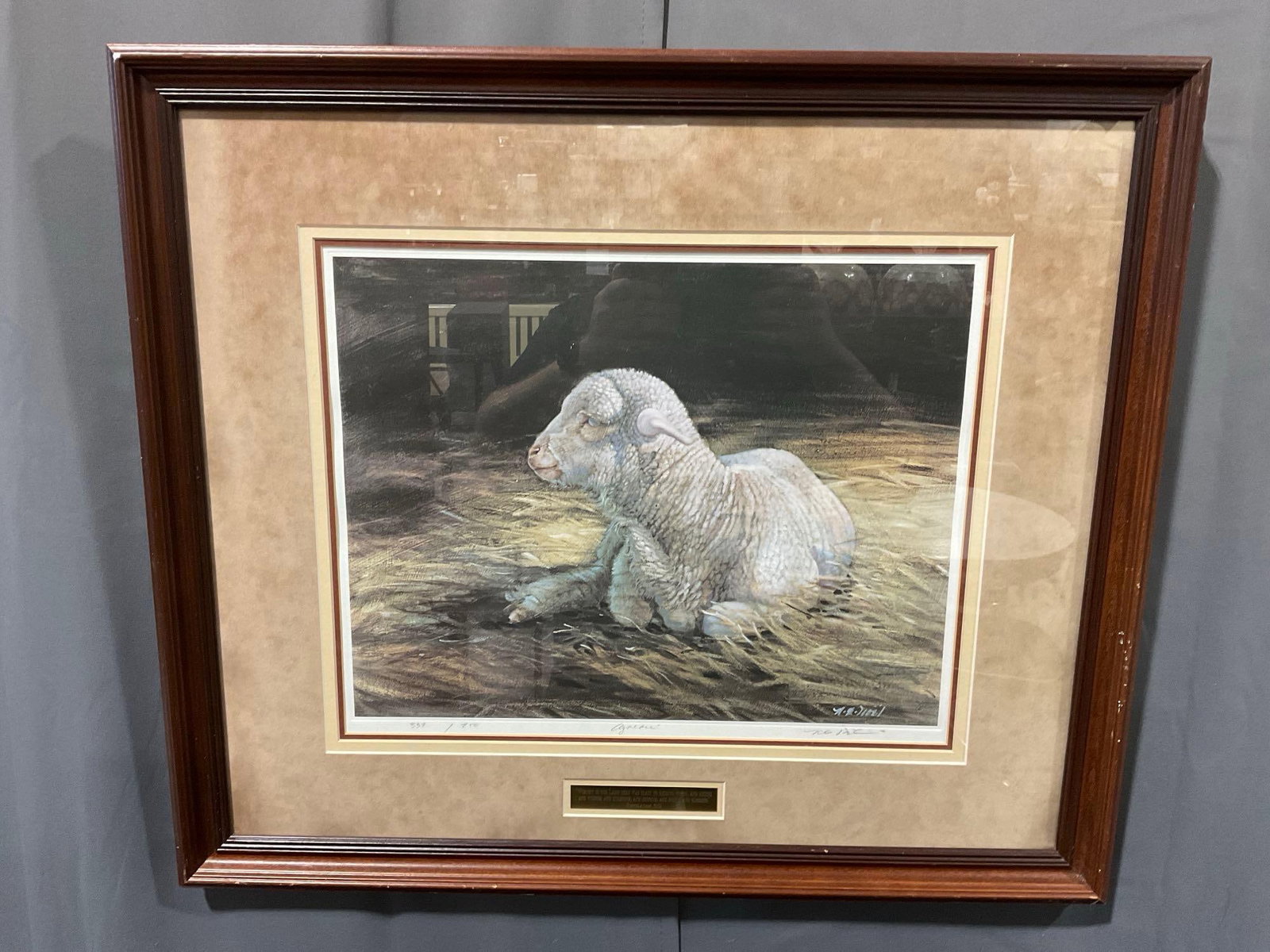 Framed Lithograph, signed & #d 339/750, Lamb art piece titled Agneau by Nancy Noel: Includes a plaque below the piece that says Revelation 5:12 Worthy is the Lamb that was slain to receiver power, and riches, and wisdom, and strength, and honour, and glory, and blessing. Appears to