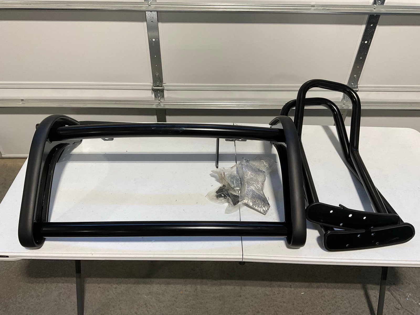 Black Tubular Grille Guard & Push Bar, w/brackets, & bolts, side pieces not attached Appears Unused: Appears to be in good shape. The piece measures approx 13h x 37w x 24d inches. See pics. E-5910 *Freight Required if shipped, Buyer Arranged/Responsibility*