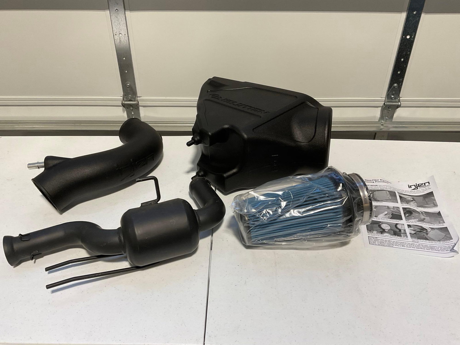 Injen Evolution Performance Cold Air Intake, 4 pieces appears unused: Appears to be in good shape. The piece measures approx 14h x 35w x 19d inches. See pics. E-5910 *Oversized shipping may apply*