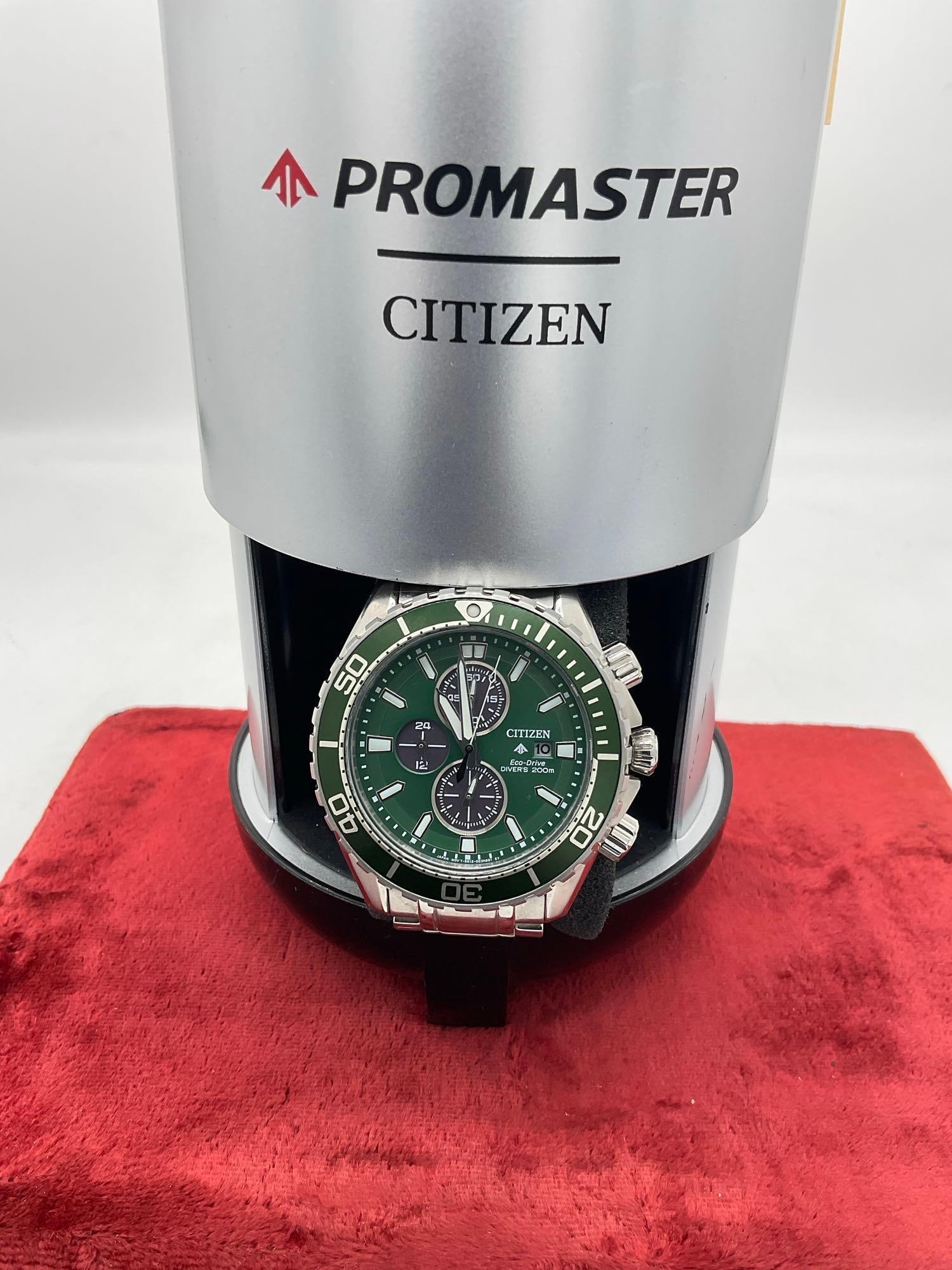 Citizen Promaster eco driver diver's 200m B612-A19NK01 Green face Mens watch w/ presentation Tank: C-5910 Comes in OG collectors diver's tank presentation display Watch is currently running , Sold-As Is AI Generated Info: The Citizen Promaster Eco-Drive Diver 200m (often seen in variati
