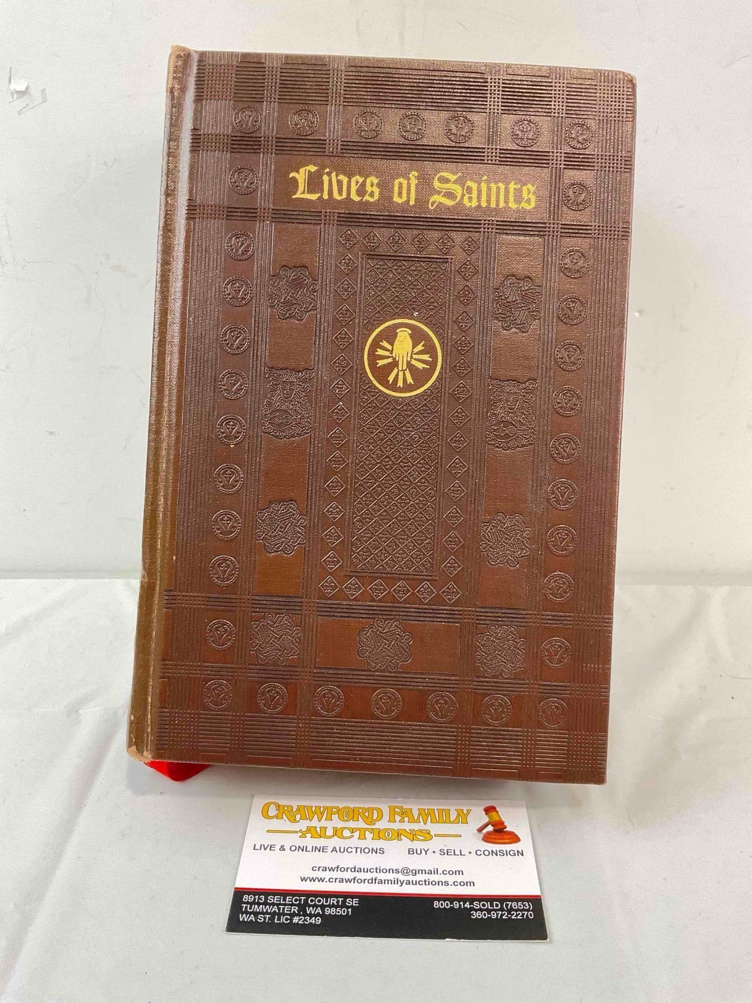 Vintage Hardcover Leather-bound Book "Lives of Saints". Fair Condition. See pics.: Vintage Hardcover Leather-bound Book "Lives of Saints". Fair Condition. Published in 1954. Wear indicative of age and use, otherwise looks to be in fair condition. Measures 6" x 9" x 10" Dm-5860