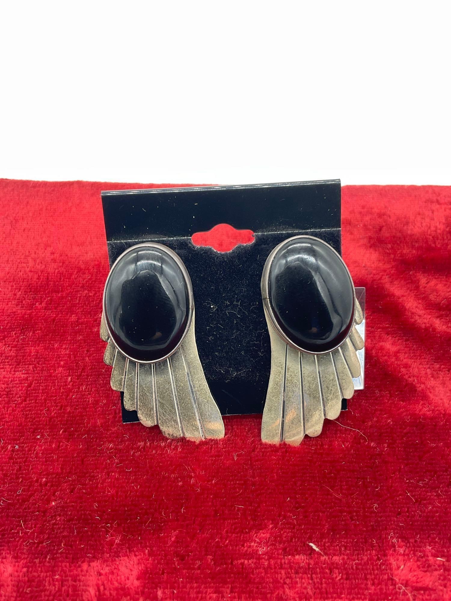 Pair Signed Nakai Sterling silver Sw Navajo wing designed earrings w/ Black Onyx Polished Cabochons: Signed Nakai Nakai refers to several Navajo silversmiths, often working as a family , (Gilo & Grace Nakai ), known for classic Navajo styles like turquoise/coral inlay, stamped designs, and Storyt