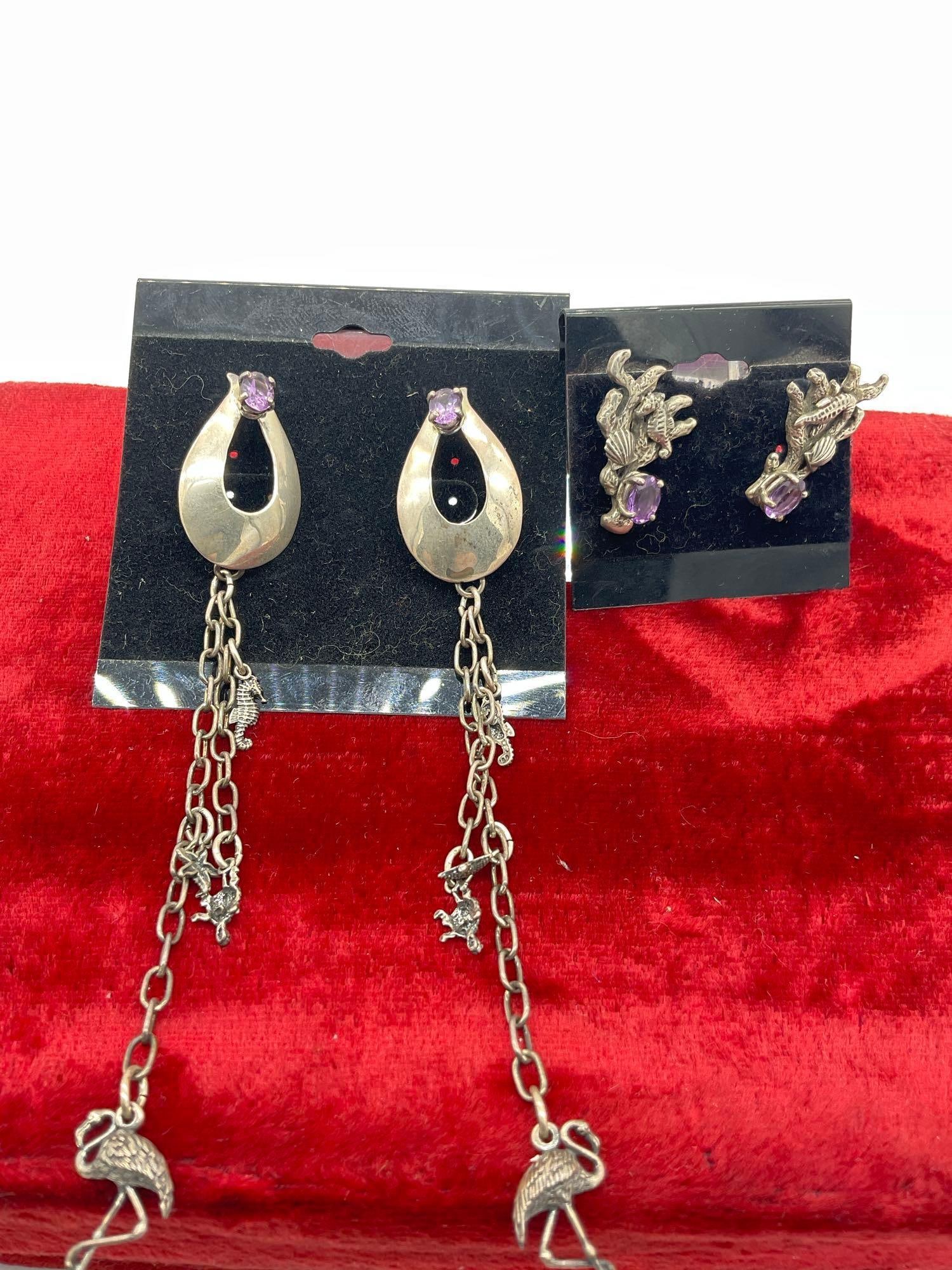 2x pair of carol Felly Sterling Silver Coral Reef themed earrings w/ Amethyst stones: On set has Long dangles w/ seahorse, star fish, turtle and Flamingo figures. Earrings and dangles are approx 5 1/4" in length 