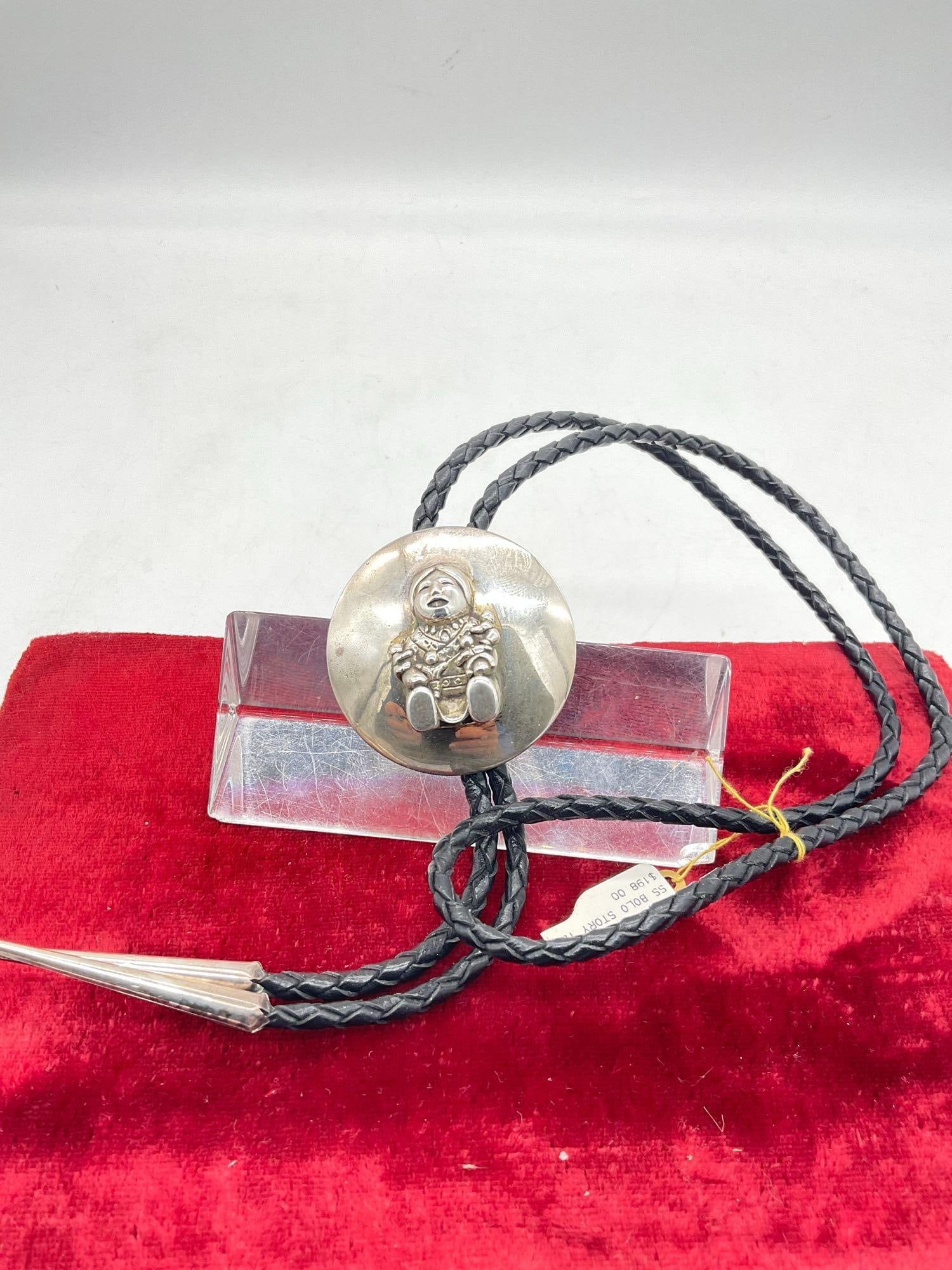 South west Native American Sterling Silver Story teller Bolo tie w/ sterling tips: Bolo Slider is 2" in circumference possible Navajo or Zuni, unmarked Tested Positive for silver. Bolo tie is 19" long 