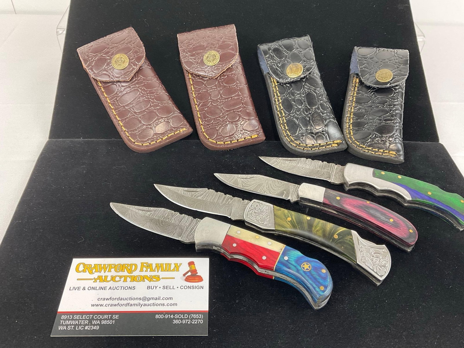 4 Handmade Folding Knives, Damascus style blades, Custom Handles & Leather Sheaths: Appears to be in good shape. The piece measures approx 6h x 5w x 4d inches. See pics. E-3440