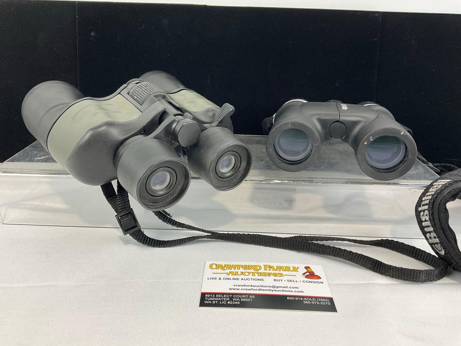 Pair of 10x25 Bushnell Explorer & Rugged Exposure 10x-30 x 50mm Binoculars: Appears to be in good shape. The piece measures approx 9h x 8w x 5d inches. See pics. E-5860