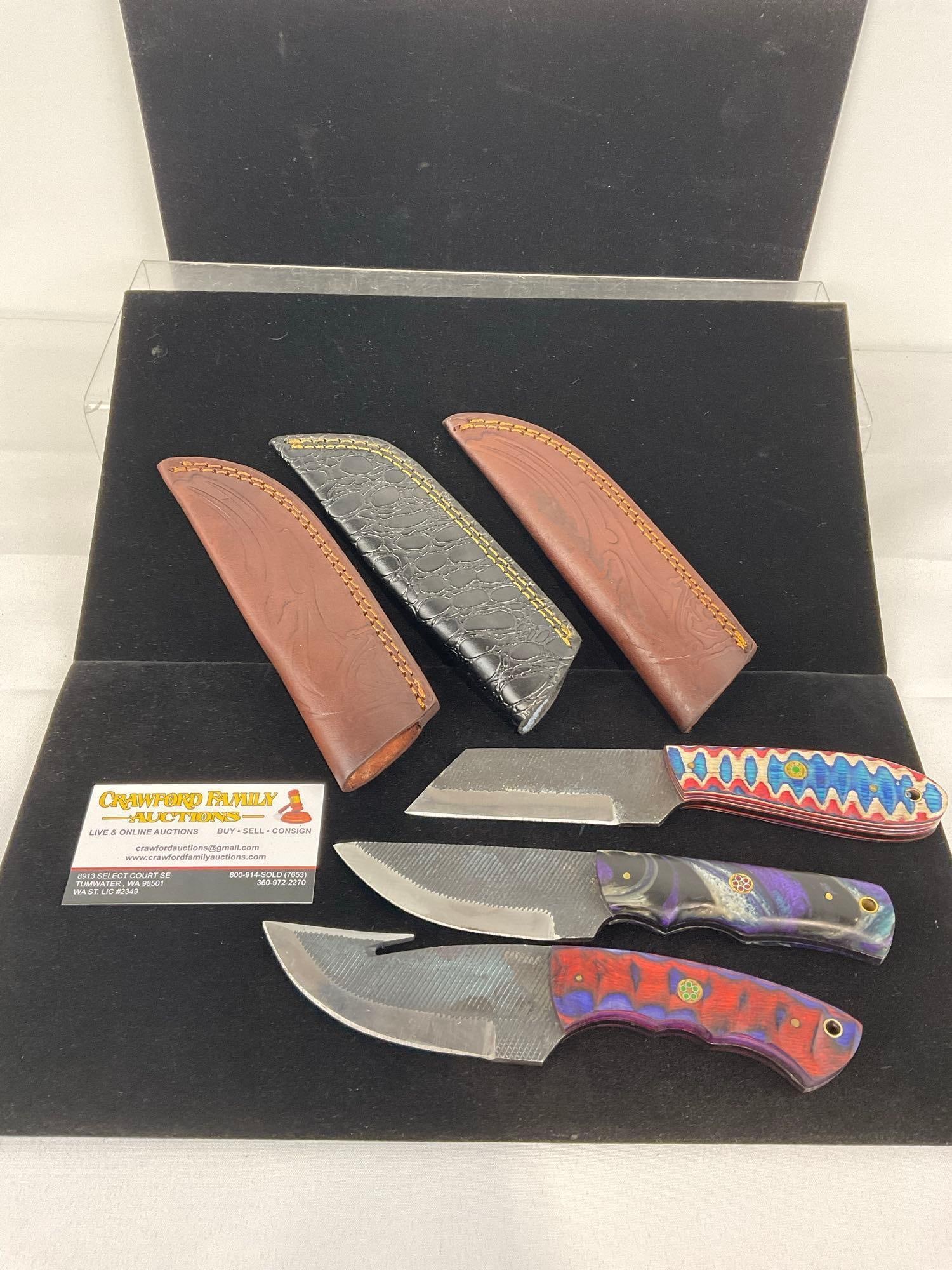 3 Handmade File Metal Knives, Tinted Wood & Resin Handles, & Leather Sheathes: Appears to be in good shape. The piece measures approx 12h x 4w x 3d inches. See pics. E-3440