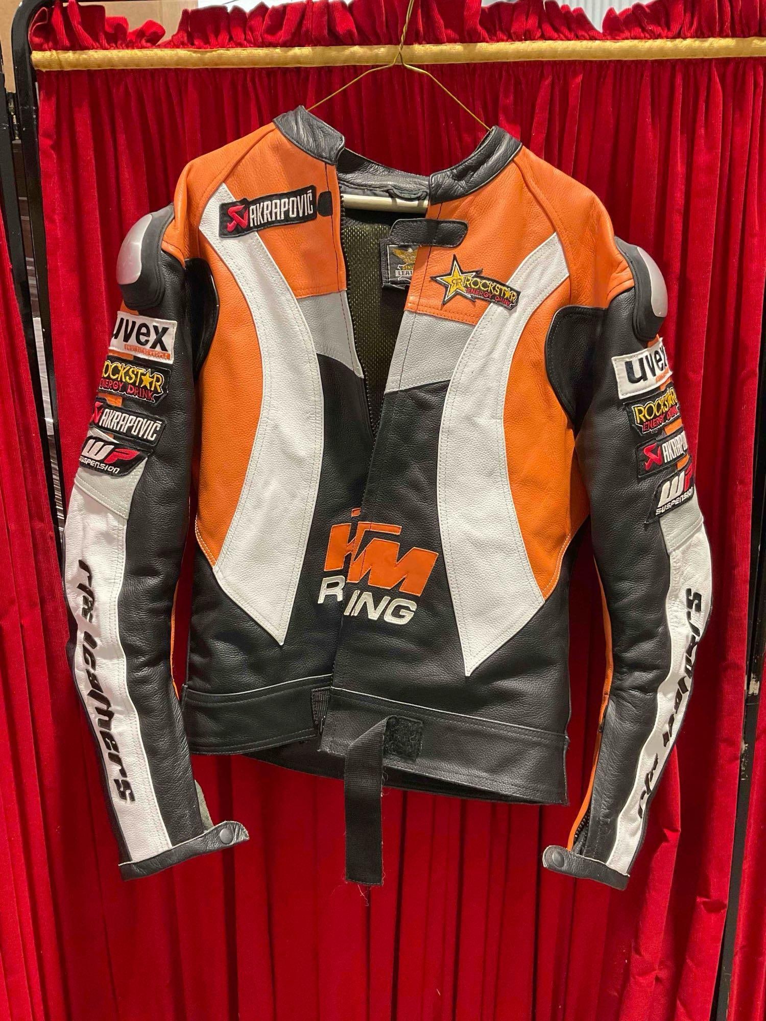 KTM Racing Orange/Black/White Leather Motorcycle Racing Jacket in Size XL. See pics.: KTM Racing Orange/Black/White Leather Motorcycle Racing Jacket in Size XL. Looks to be in good condition, consignor was a collector who kept jackets in storage. Measures 23" x 32" x 5" DM-5910