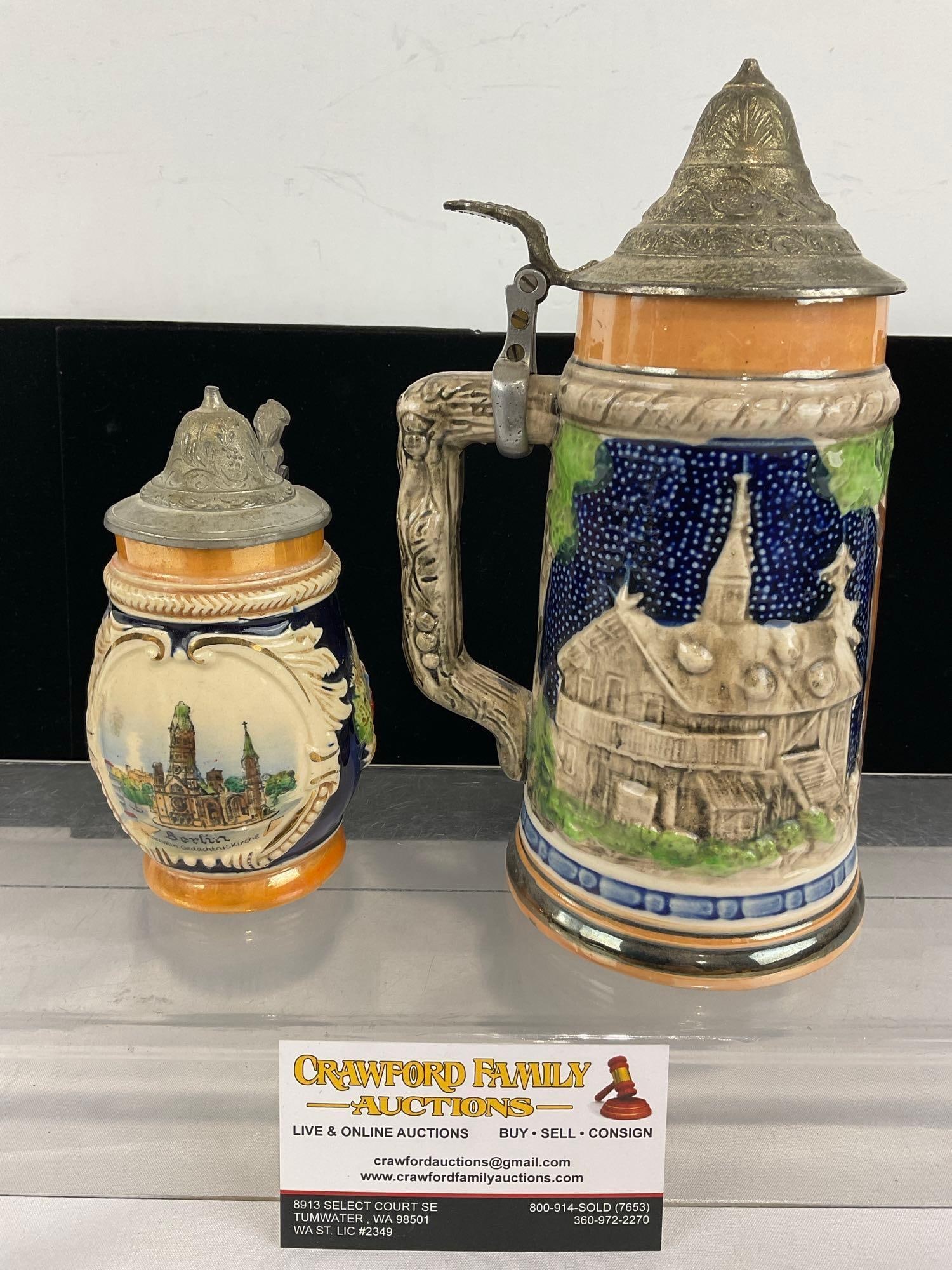 Pair of Beer Steins, Cobalted Castle Designs w/Pewter lids: Appears to be in good shape. The piece measures approx 7h x 10w x 6d inches. See pics. E-5860