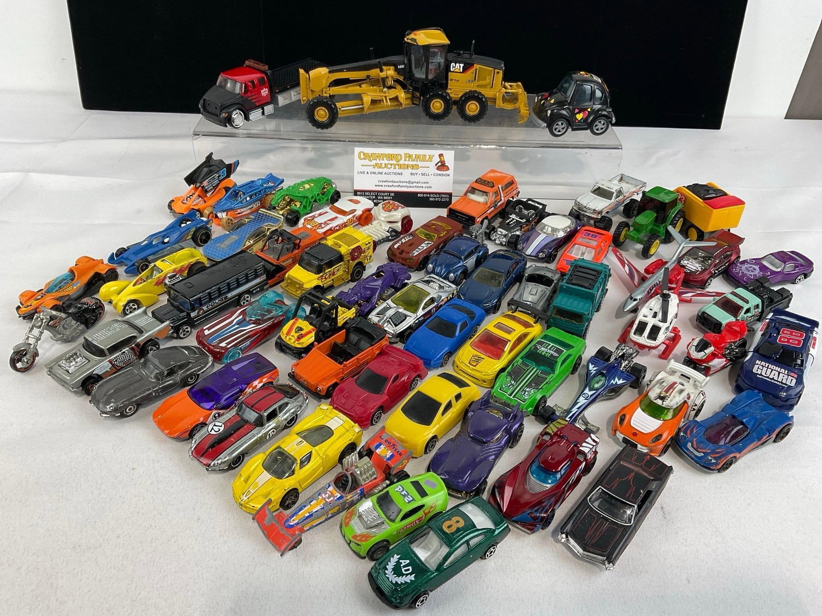 Collection of approx 60 Hot Wheels & Matchbox Cars, variety of pieces: Appears to be in good shape. The piece measures approx 6h x 14w x 9d inches. See pics. E-5860