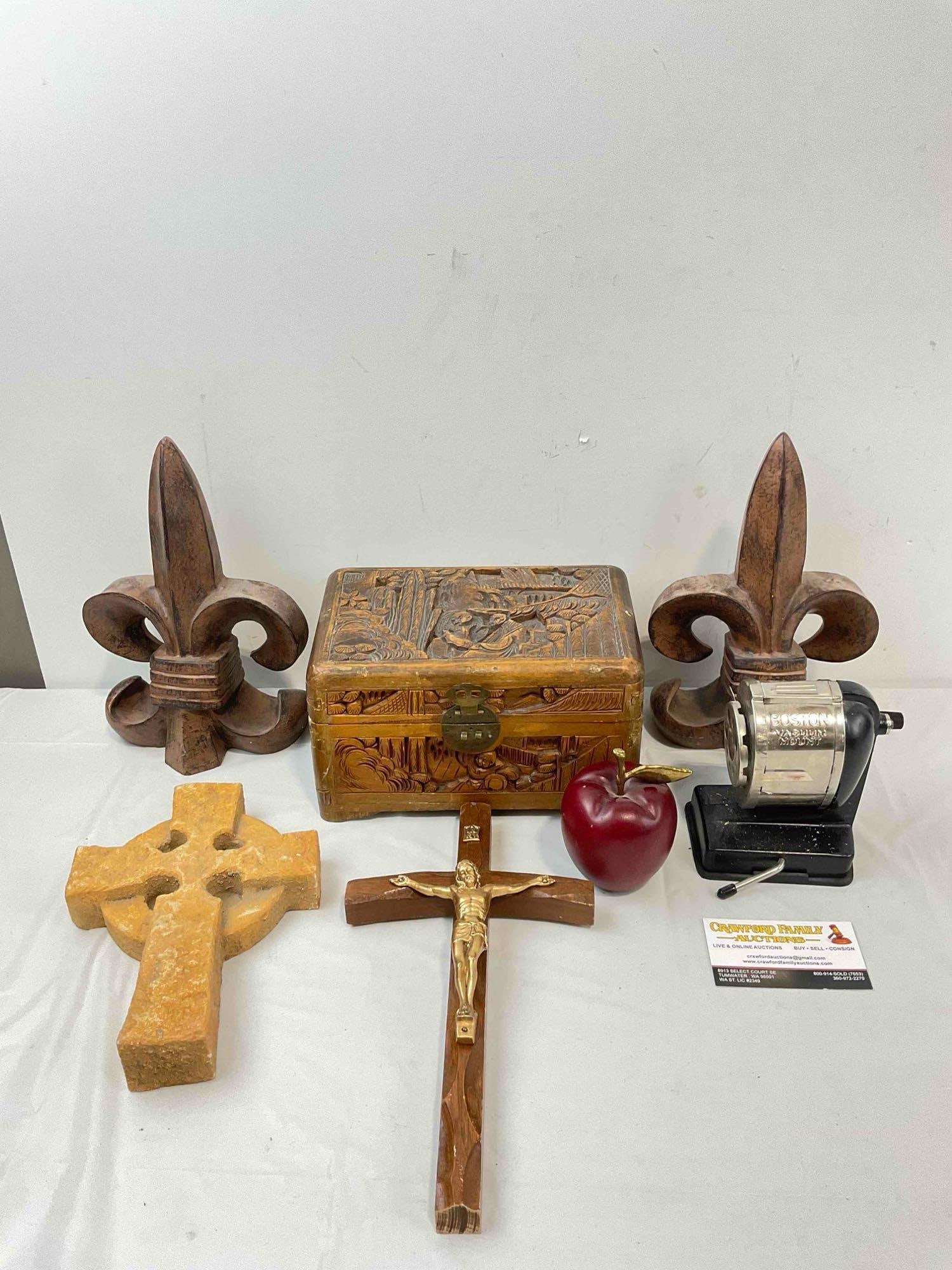 7 pcs Decorative Assortment, incl. 2x Wall Crosses, Pair of Cast Iron Fleur de Lis Book Ends.: 7 pcs Decorative Assortment, incl. 2x Wall Crosses, Pair of Cast Iron Fleur de Lis Book Ends. Also includes carved box, wood & brass apple and vintage pencil sharpener. Minor wear indicative of ag