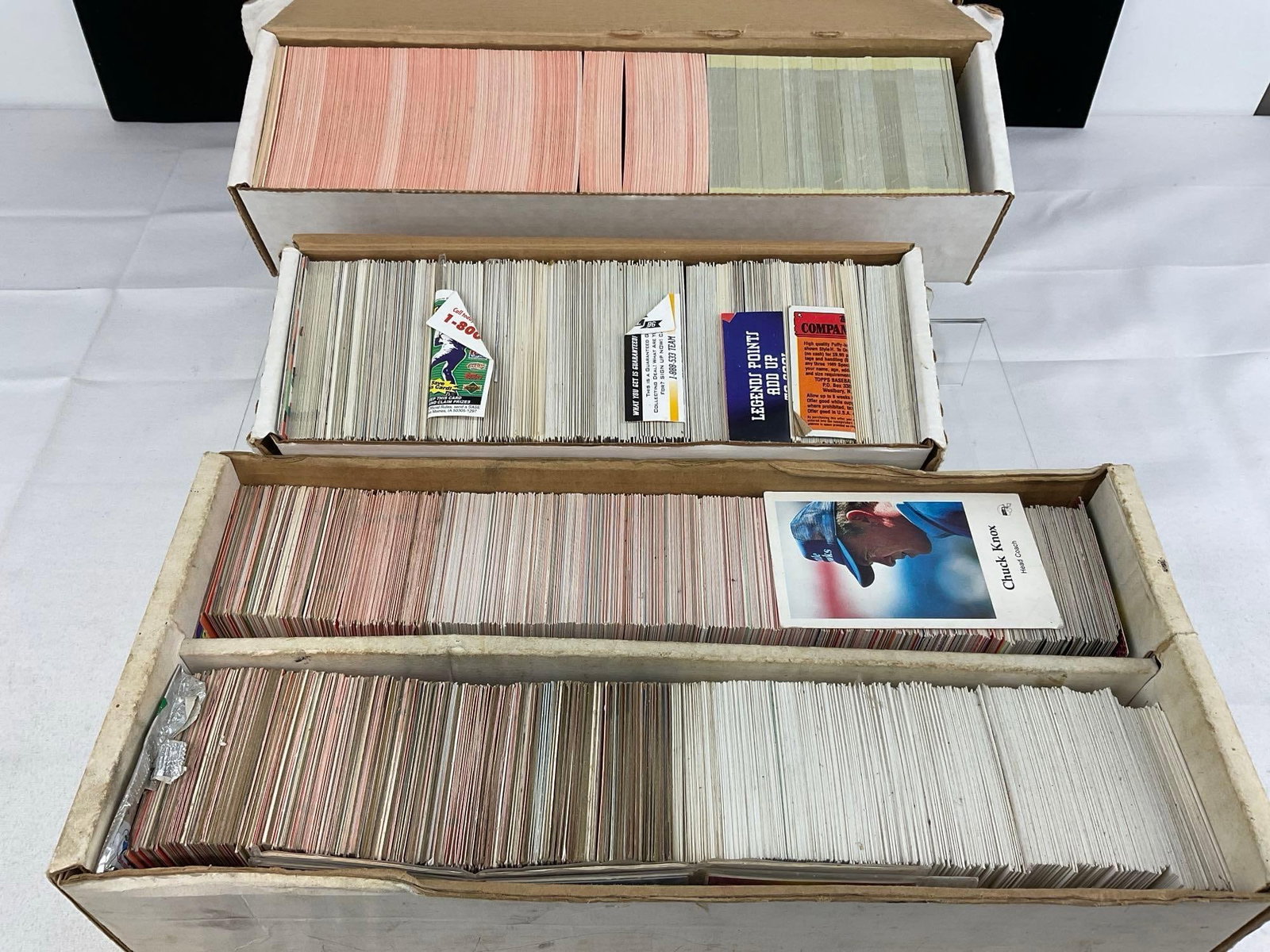 Vintage 3500+ Sports Cards, Baseball & Football, NFL Pro, Donruss, Topps, Upper Deck & more: Several boxes of sports cards, unresearched, and all from the same collection. Appears to be in good shape. The piece measures approx 5h x 19w x 16d inches. See pics. E-5940