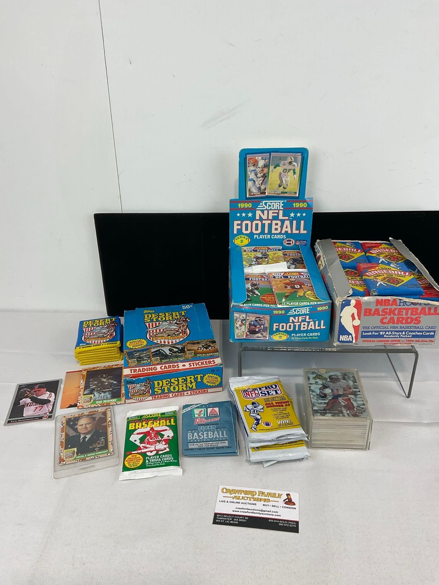 Several Unopened Card Packs w/boxes, Desert Storm, SCORE NFL FOOTBALL, Bowman 1990 Baseball & more: Several boxes of sports cards, unresearched, and all from the same collection. Appears to be in good shape. The piece measures approx 5h x 19w x 16d inches. See pics. E-5940