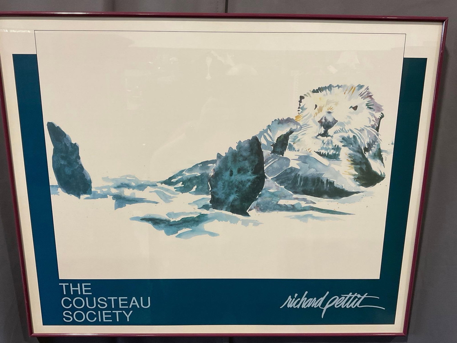 Framed Otter Gallery Print, Richard Pettit for The Cousteau Society, 25h x 31w x 2d inches: Appears to be in good shape. The piece measures approx 25h x 31w x 2d inches. See pics. E-5600