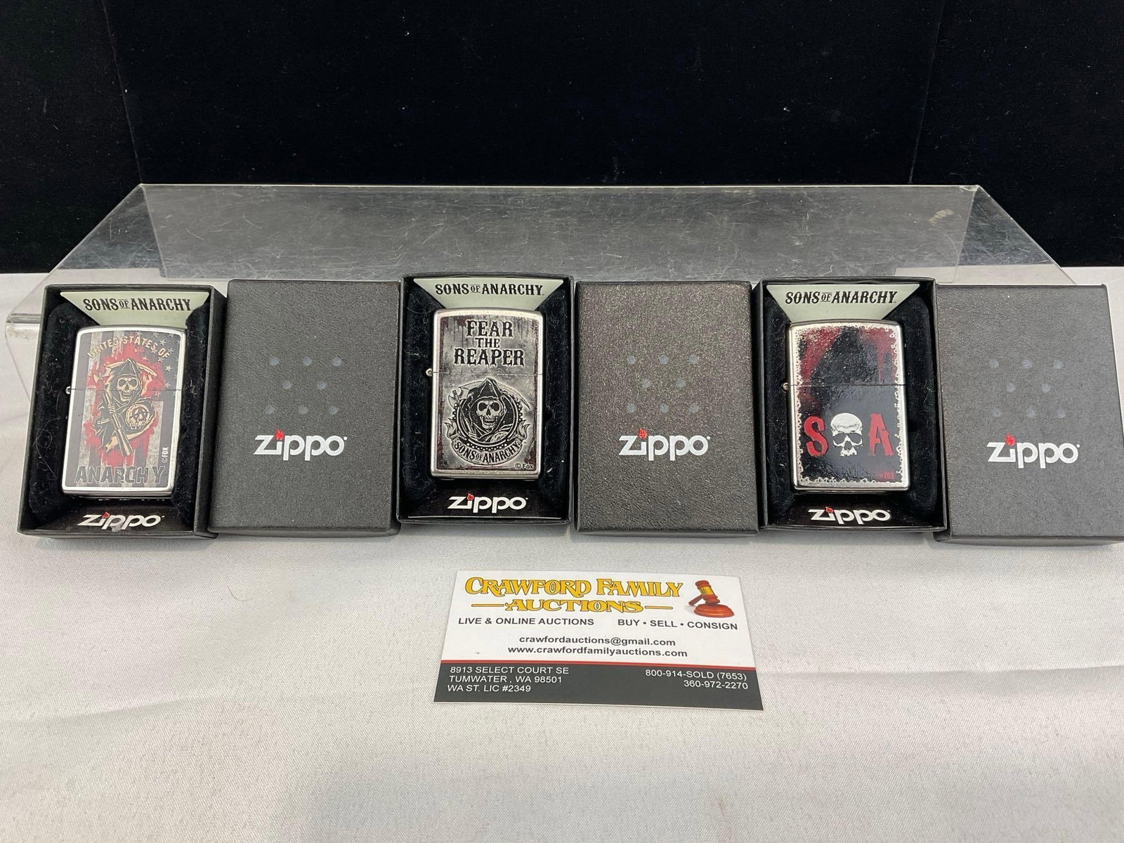 3 Sons of Anarchy Zippo Lighters, in packaging, unused, US of Anarchy, Fear the Reaper & SoA: Appears to be in good shape. The piece measures approx 3h x 4w x 3d inches. See pics. E-5940