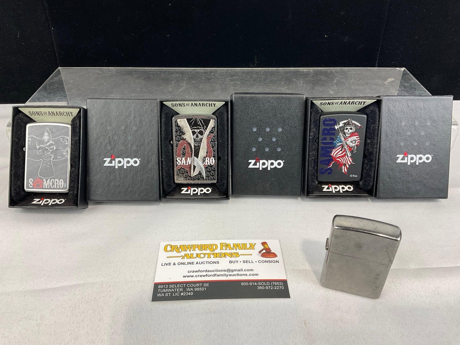 4 Unused Zippo Lighters, 3 Sons of Anarchy Samcro patterns, in packaging: Appears to be in good shape. The piece measures approx 4h x 4w x 3d inches. See pics. E-5940
