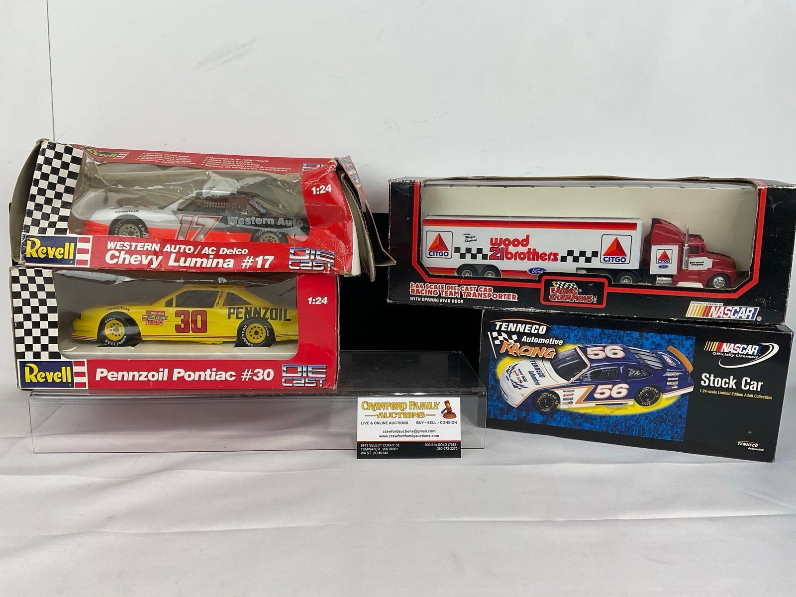2 Revell 1:32 Scale Diecast Cars, 1:44 Scale Racing Team Transporter, & Nascar Stock Car Tenneco ..: Includes Western Auto/AC Delco Chevy Lumina #17 & Pennzoil Pontiac #30. The 1:44 Scale Racing Team Transporter is for #21 Wood Brothers Citgo. Appears to be in good shape. The piece measures appro
