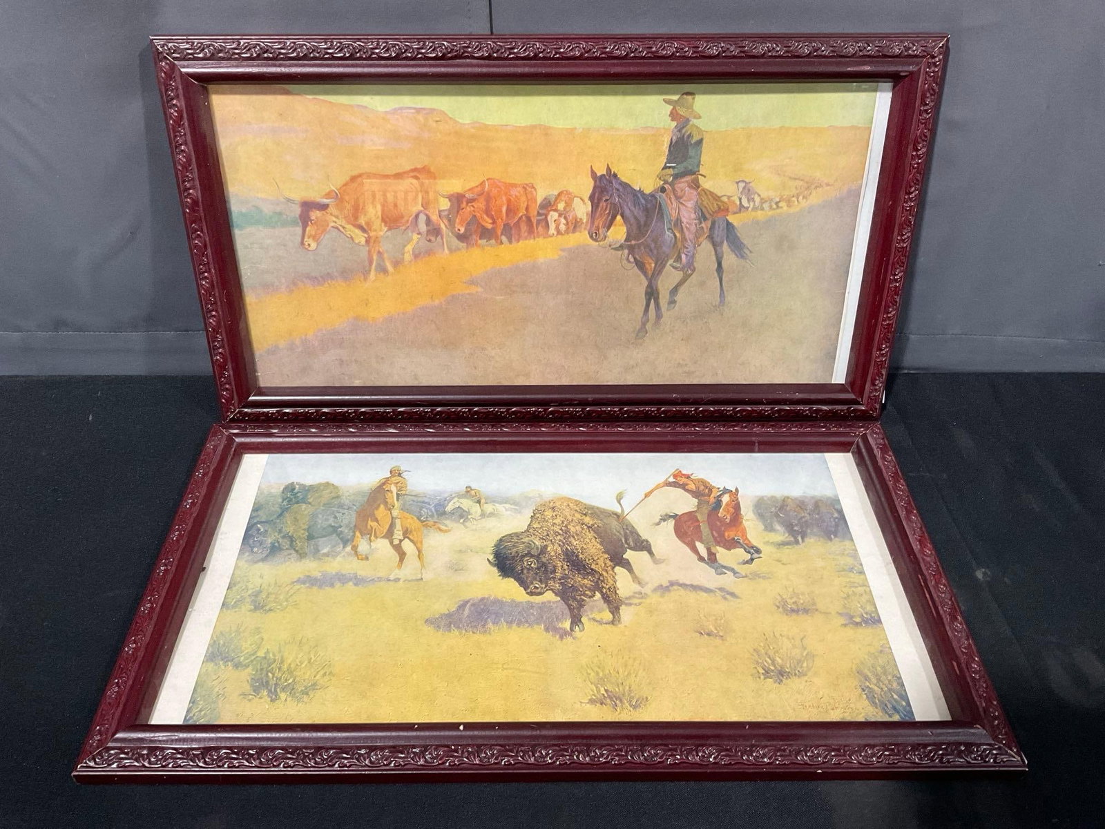 Pair of Framed Frederic Remington Prints, Trailing Texas Cattle & The Buffalo Runners, 13 x 23 inch: Appears to be in good shape. The piece measures approx 13h x 23w x 3d inches. See pics. E-5880