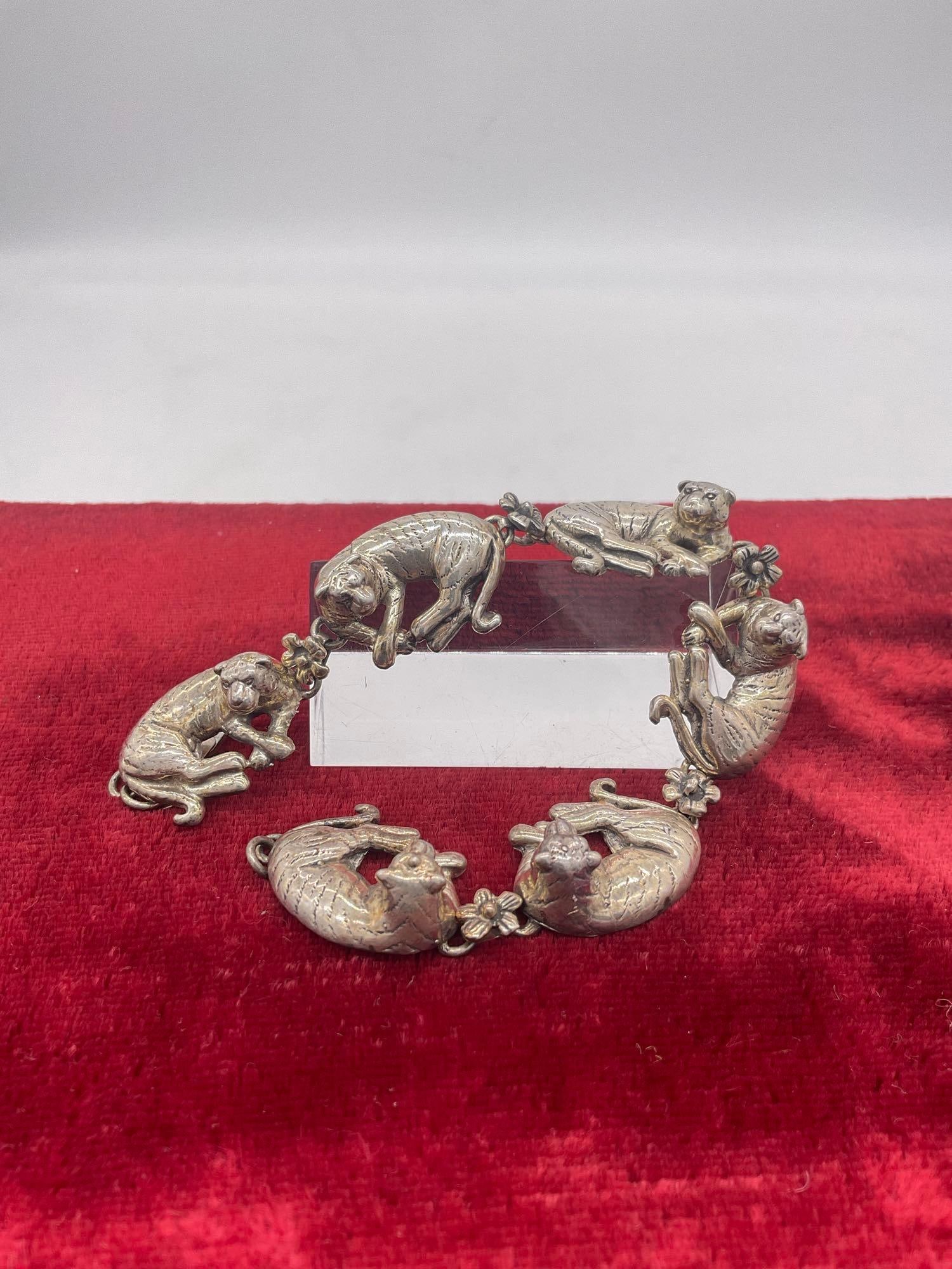 Fantastic 1990 sterling silver Carol Felley Lioness tennis bracelet with floral motif: Approx 42 grams ttw, 7" in total length