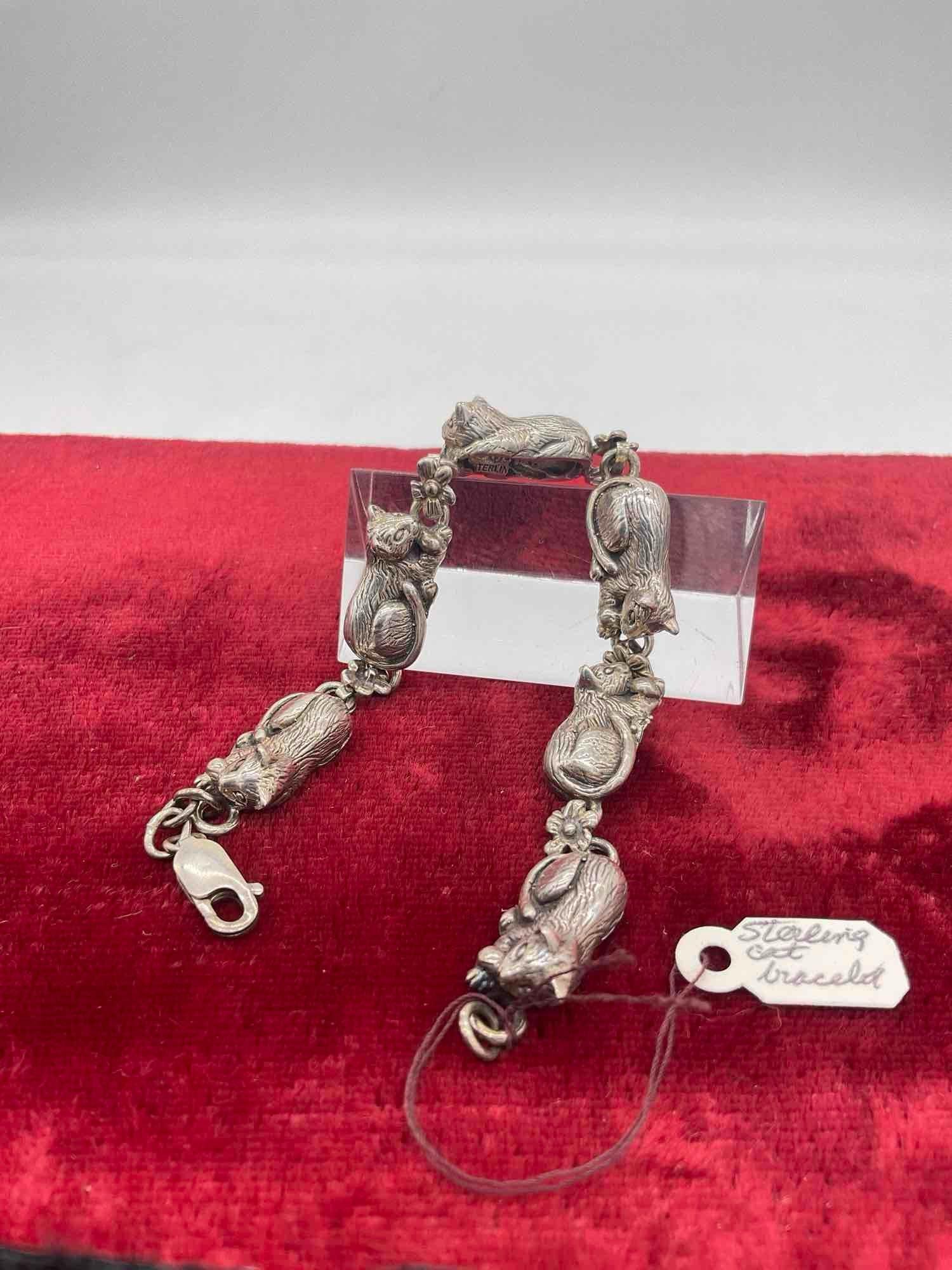 1989 Carol Felley Sterling silver southwest design Cat tennis bracelet with flower motif: Approx 7" in length spread out, and approx 32 grams ttw