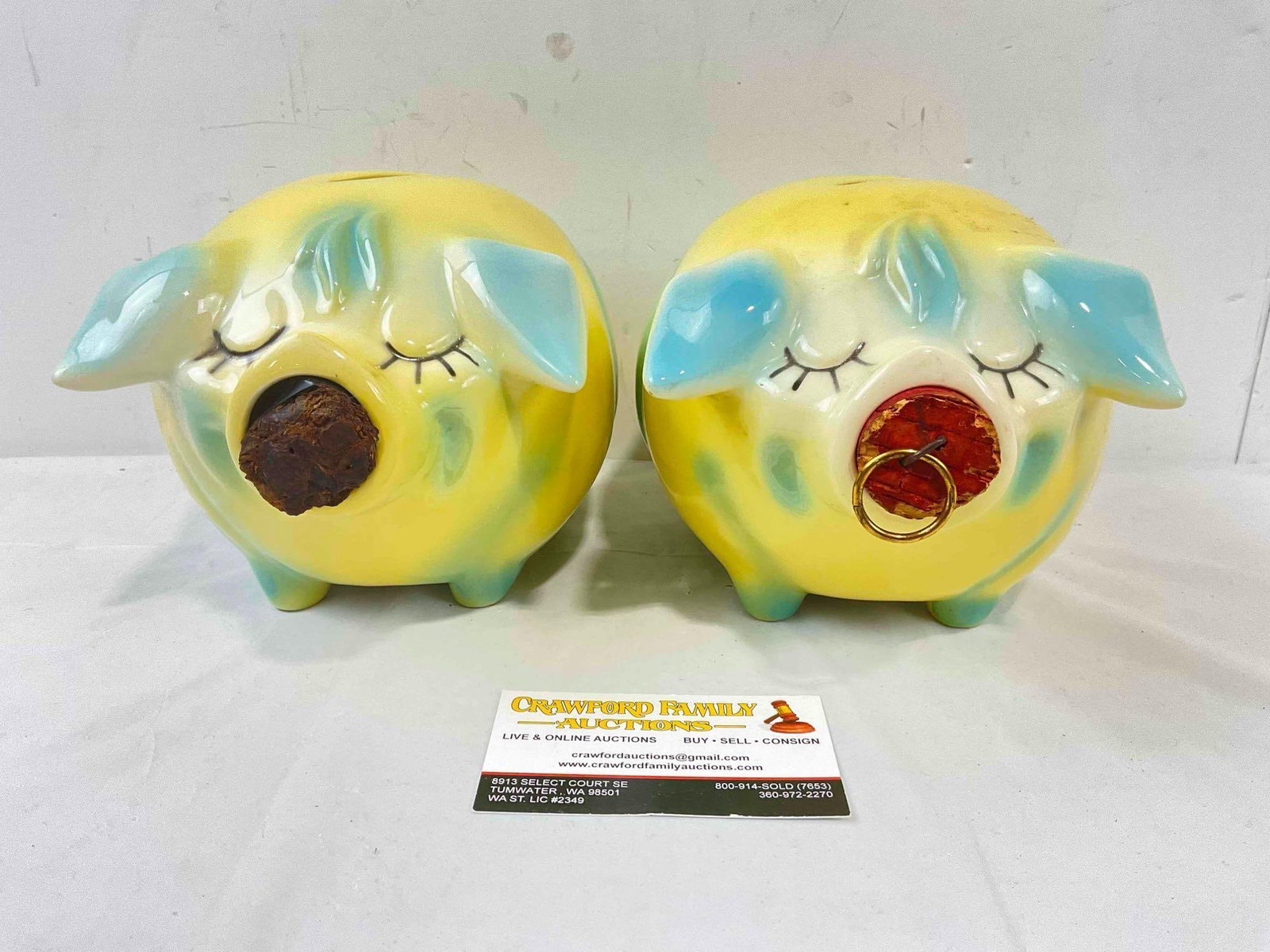 2 pcs Vintage Hull Corky Pig Ceramic Piggy Banks in Yellow & Blue Color w/ Corks. See pics.: 2 pcs Vintage Hull Corky Pig Ceramic Piggy Banks in Yellow & Blue Color w/ Corks. Have minor adhesive residue, one's cork is tired and held together with tape, the other has a tiny chip on