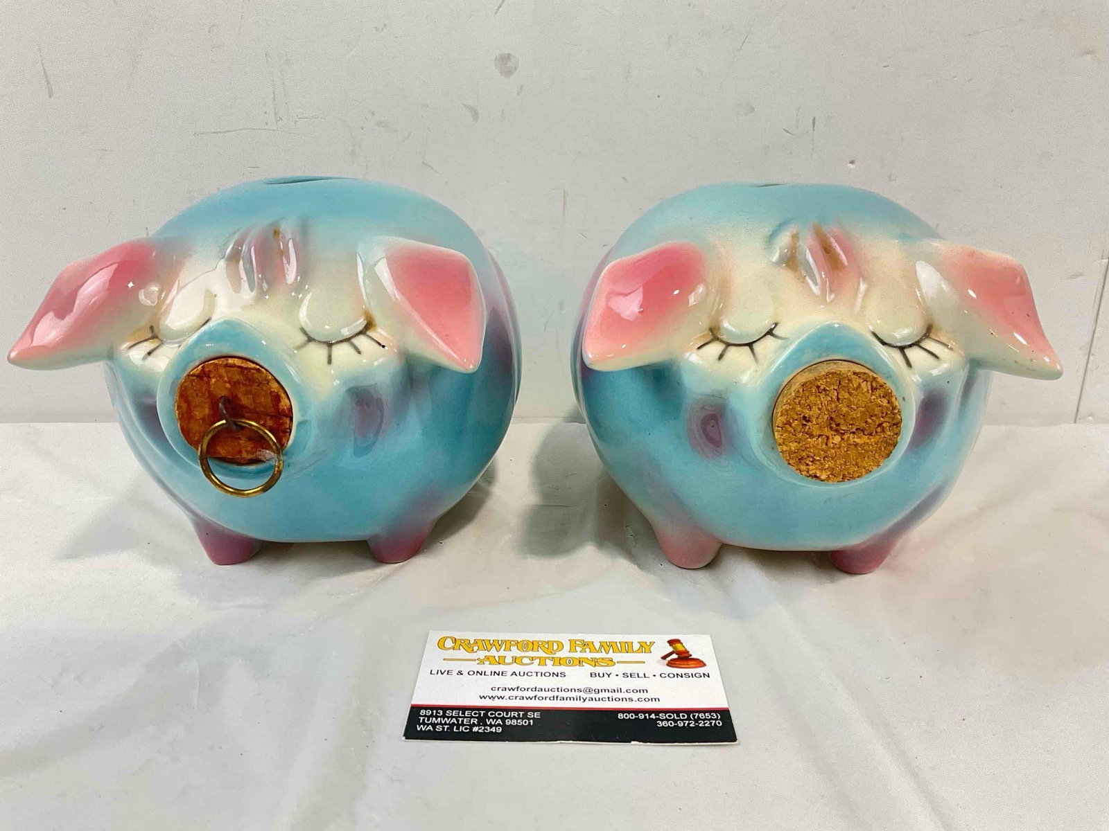 2 pcs Vintage Hull Corky Pig Ceramic Piggy Banks w/ Corks in Blue/White/Pink Color Way. See pics.: 2 pcs Vintage Hull Corky Pig Ceramic Piggy Banks w/ Corks in Blue/White/Pink Color Way. One has original cork with loop, the other's cork looks like a replacement. Both have minor adhesive stains,
