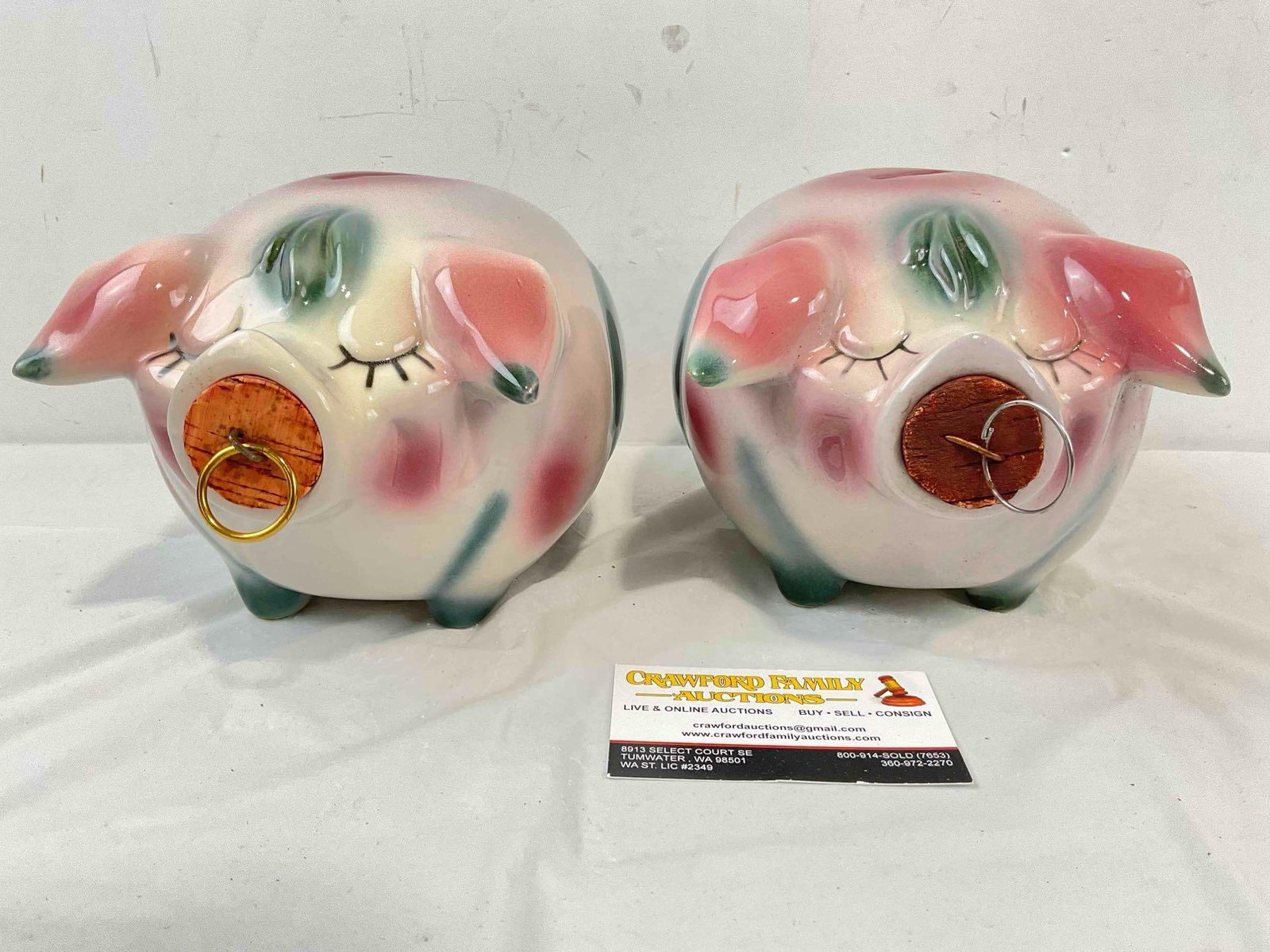 2 pcs Vintage Hull Corky Pig Ceramic Piggy Banks w/ Corks in Purple/Pink/Green Color Way.: 2 pcs Vintage Hull Corky Pig Ceramic Piggy Banks w/ Corks in Purple/Pink/Green Color Way. One has a chip on one ear, one's cork has a replacement loop, otherwise looks to be in good condition. Fits