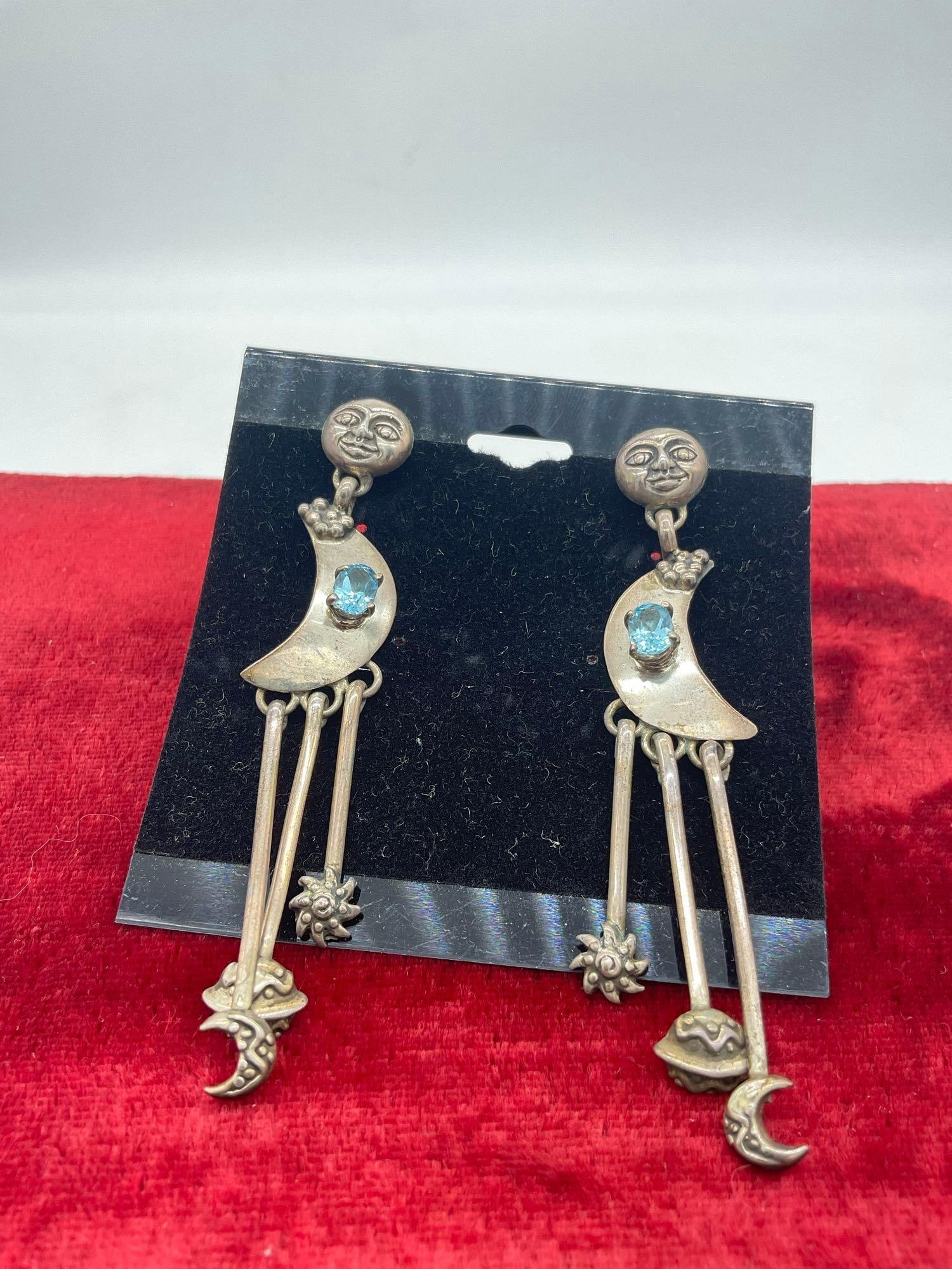 Sterling Silver vintage Carol Felley moon and stars motif earrings with blue topaz setting: Approx 3 1/2" in length, $150 orig price tag