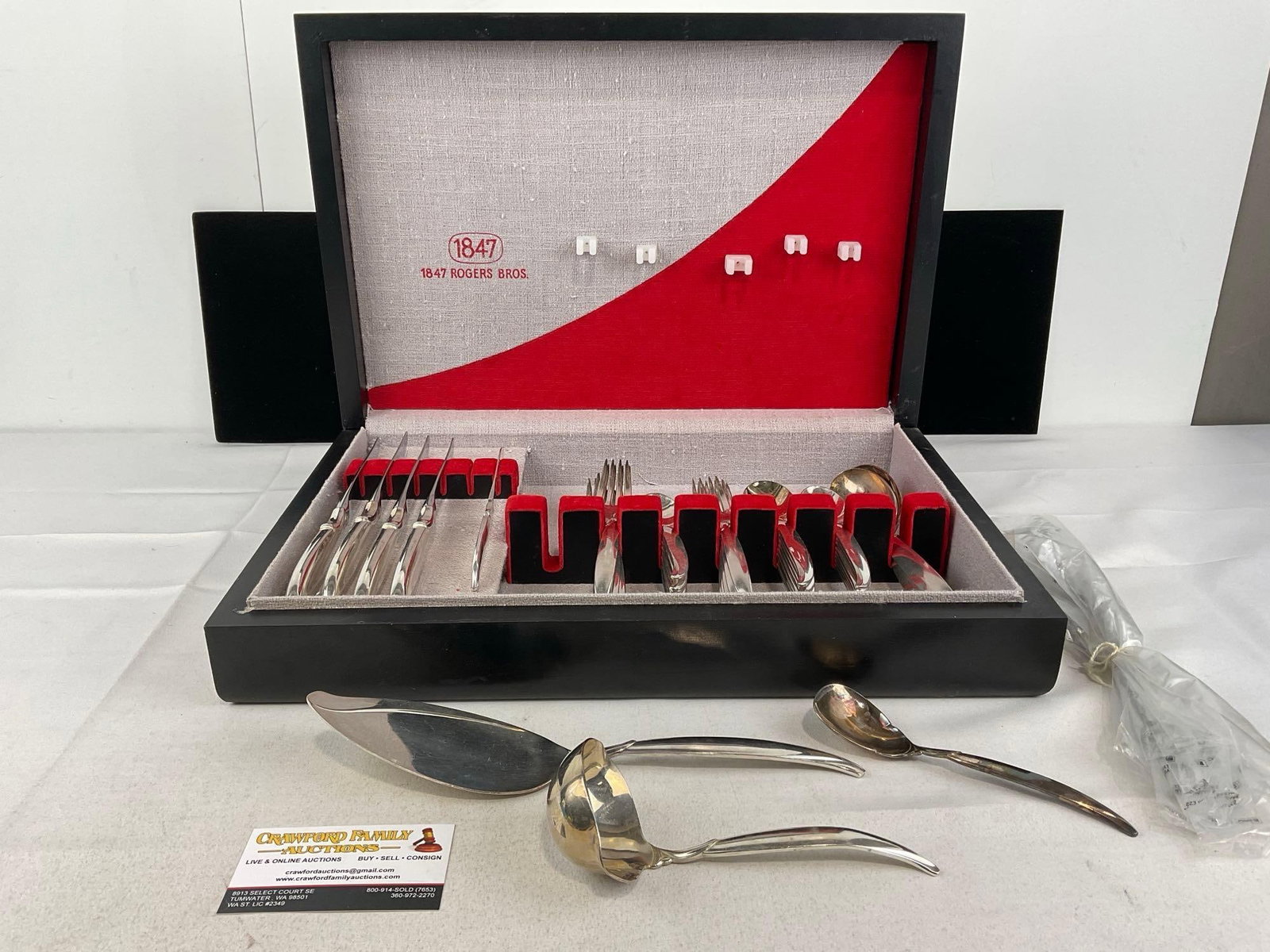 50 pcs Silver Plate Flatware, 1847 Rogers Bros Flair Pattern, Art Deco style Case: Appears to be in good shape. The piece measures approx 5h x 18w x 13d inches. See pics. E-5950