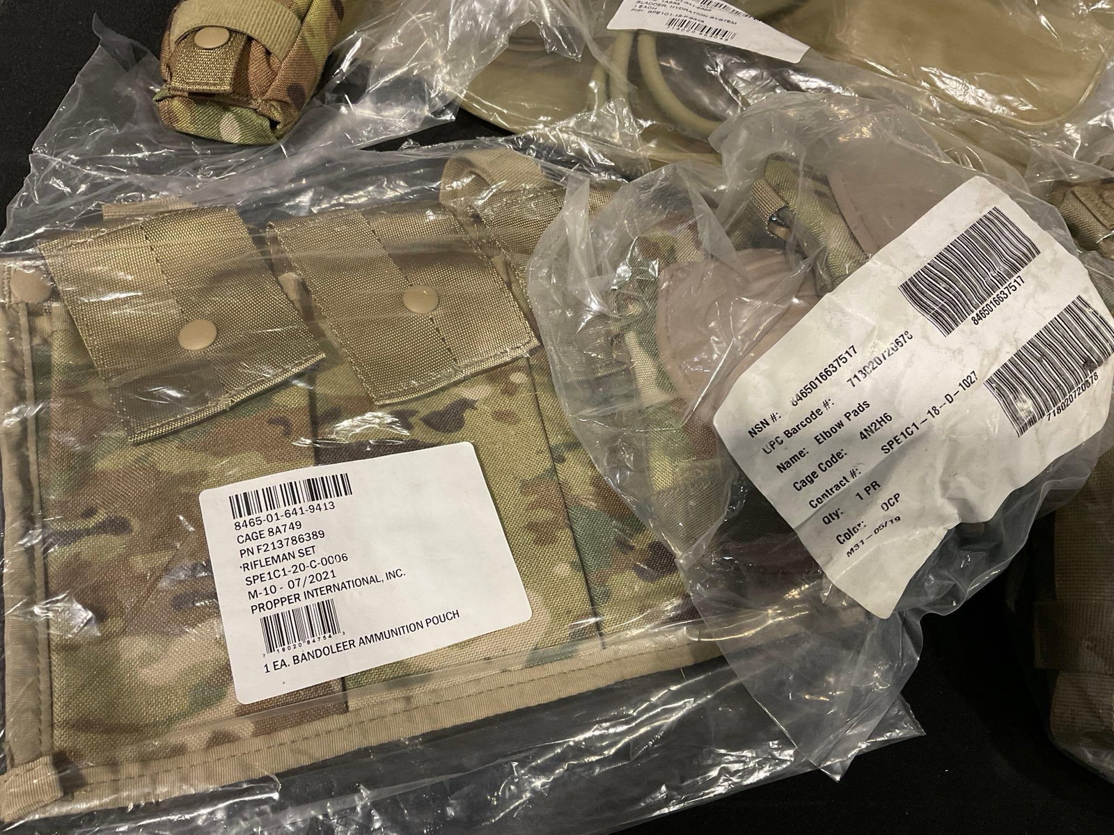 Asst Combat Supplies, Kneepads, Flashlight, 2 Canteens, 2 Magazine Holsters, 2 Hydration Bladders... - 2