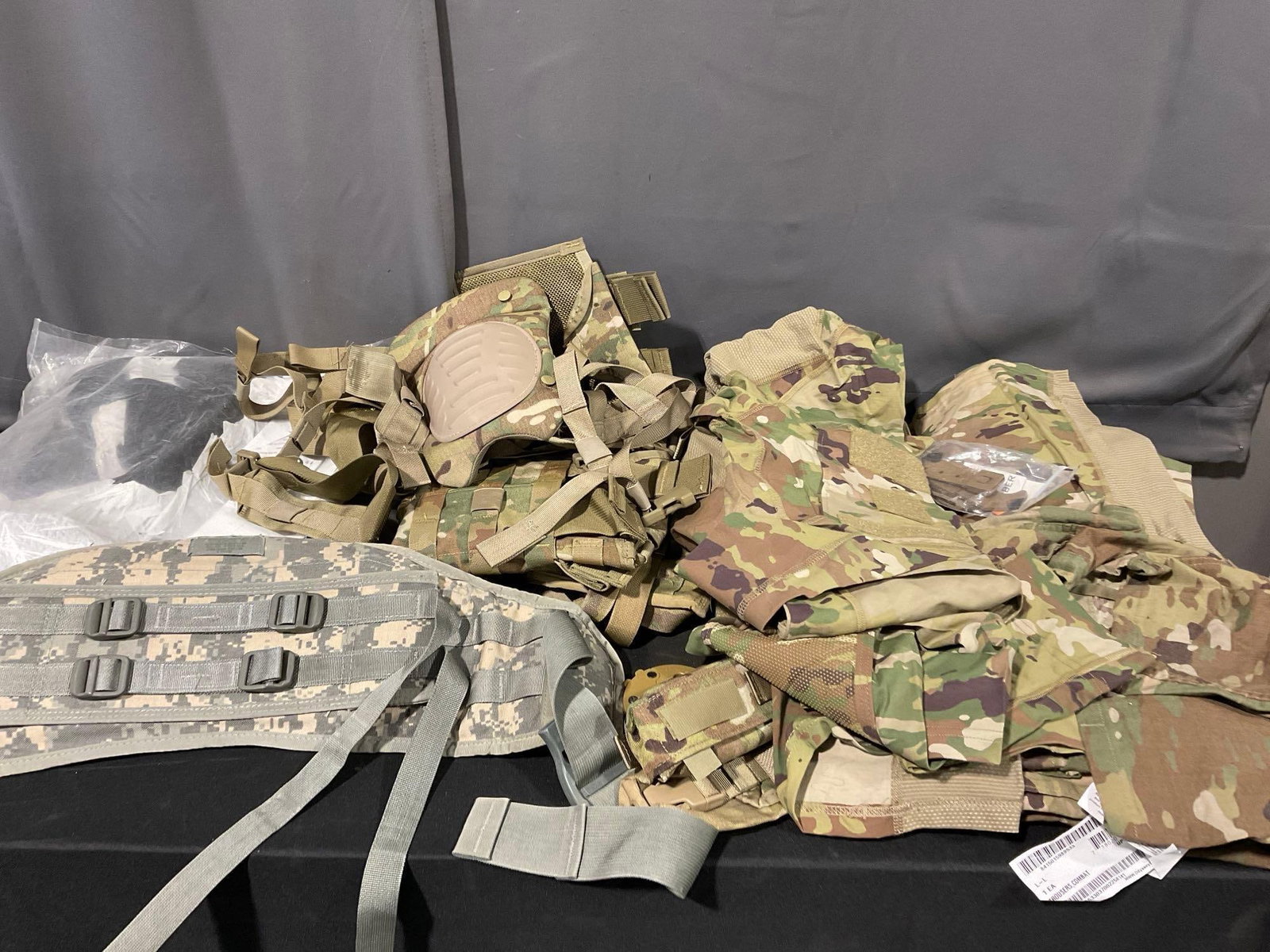 Asst Milsurp, Woodland Camo Magazine Holsters, Braces, variety of coats & AC Shirts, size 2XL: Appears to be in good shape. The pieces fit in a tub that measures approx 16h x 22w x 17d inches. See pics. E-5880