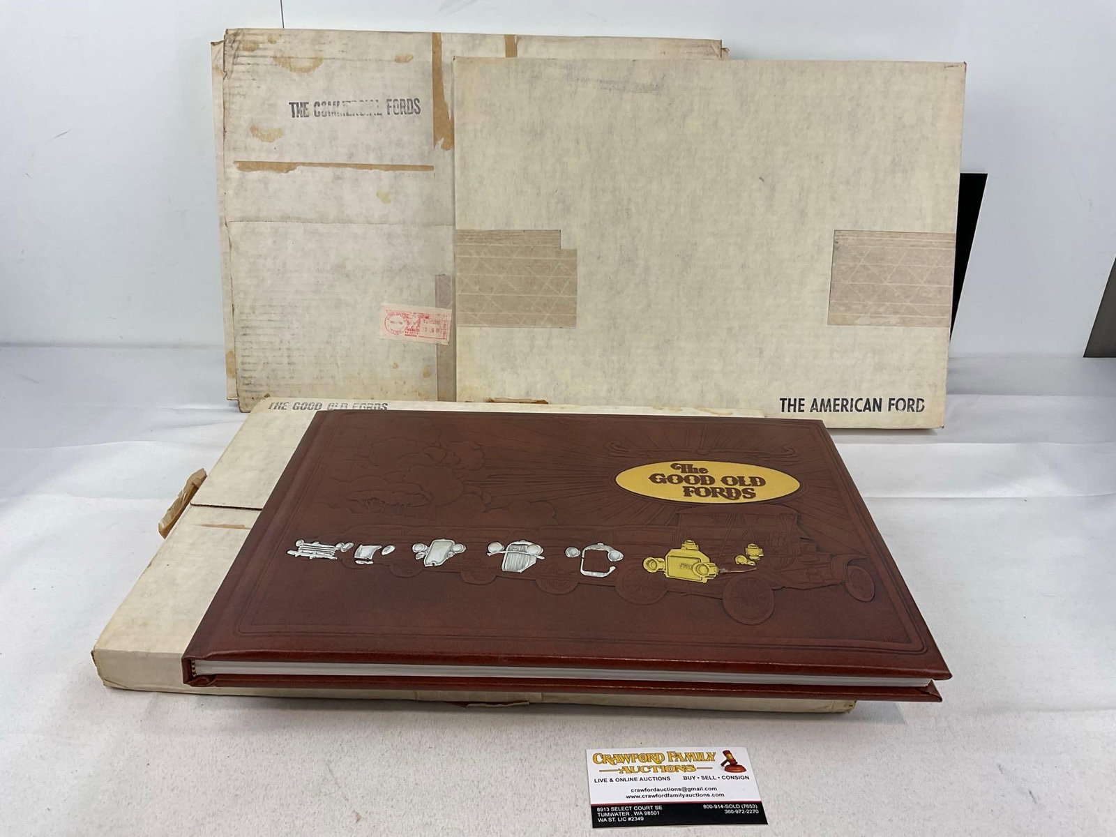 Set of 3 Sealed 1940s Leather Bound Fordiana Books, by Lorin Sorensen, 18h x 13w x 5d inches: Includes: The Gold Old Fords, The Commercial Fords, & The American Ford. Similar to the last lot. Appears to be in good shape. The piece measures approx 18h x 13w x 5d inches. See pics. E-5950