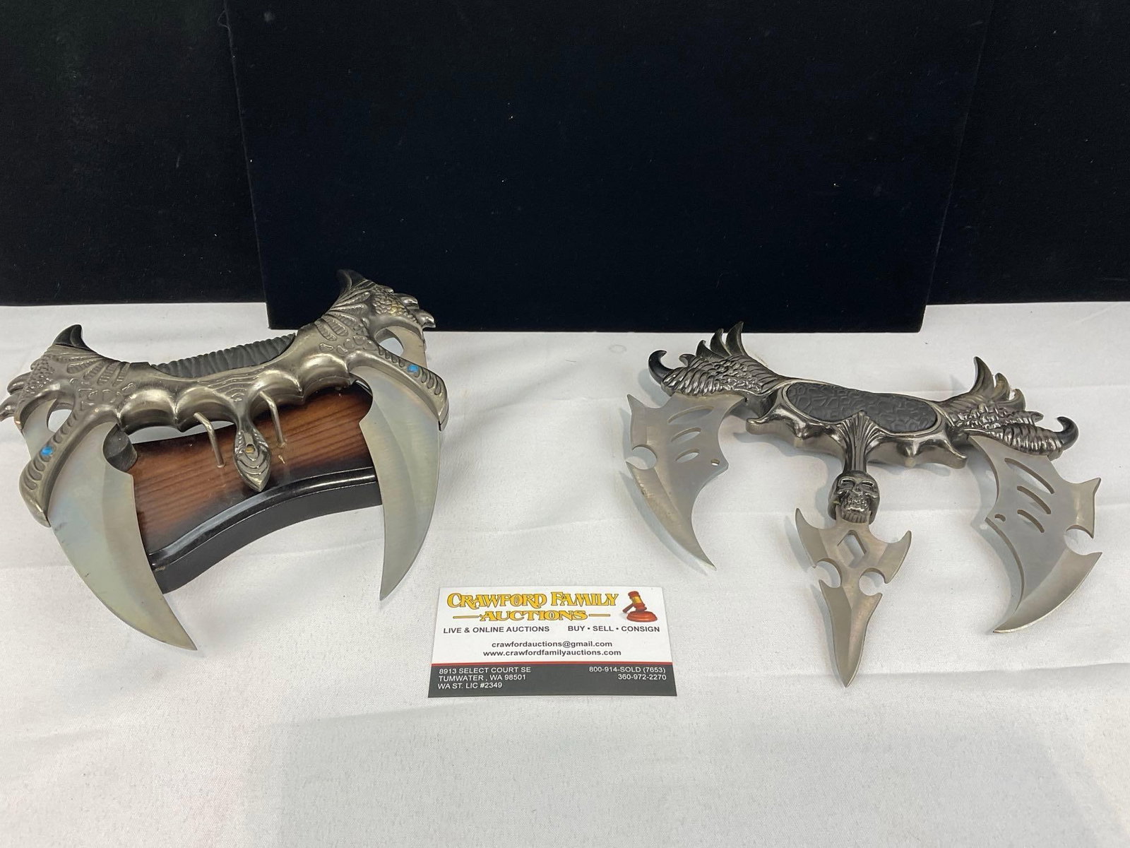 Pair of Fantasy Daggers by United Cutlery, Kit Rae Fang of Baelin & 3 prong Fist Knife: Appears to be in good shape. The piece measures approx 4h x 10w x 9d inches. See pics. E-5940