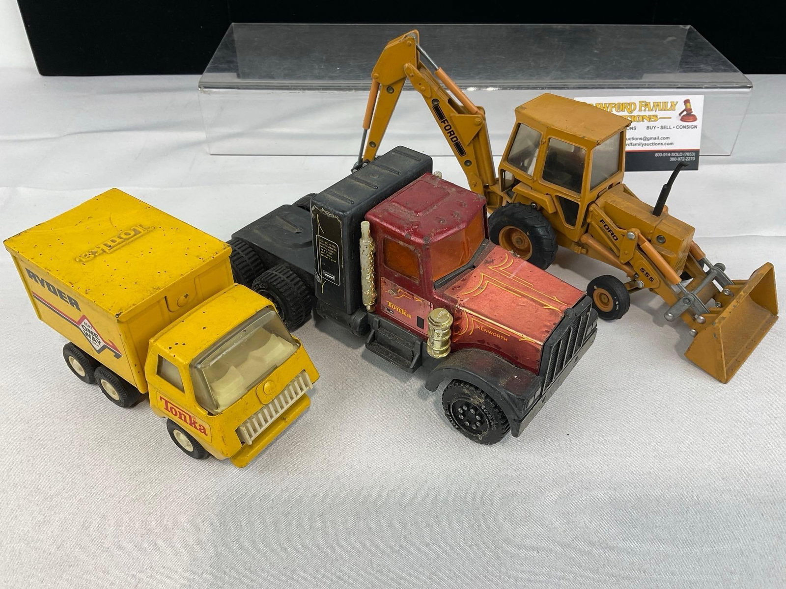 3 1/32 Scale Diecast models, Ford 555A Backhoe, 78 Tonka Ryder Box Truck & Tonka Kenworth Semi-Tr... - 3