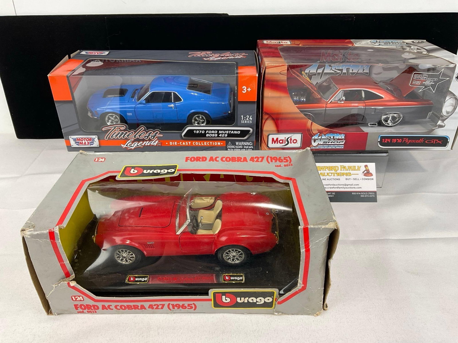 3 Diecast 1:24 Scale Cars, 1965 Burago Ford AC Cobra 427, 70 Ford Mustang Boss 429 & 70 Plymouth ...: Appears to be in good shape. The piece measures approx 13h x 11w x 6d inches. See pics. E-5940