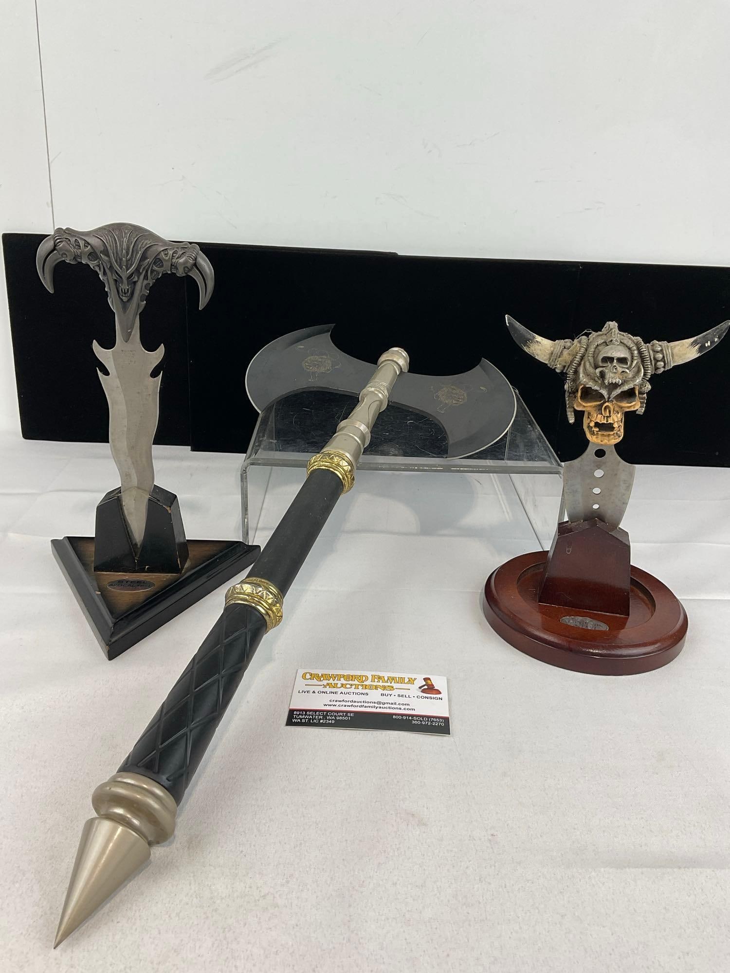 2 Fantasy Fist Daggers w/Stands & Metal Double Bladed Axe, w/Lion Designs: Appears to be in good shape. The piece measures approx 5h x 21w x 10d inches. See pics. E-5940