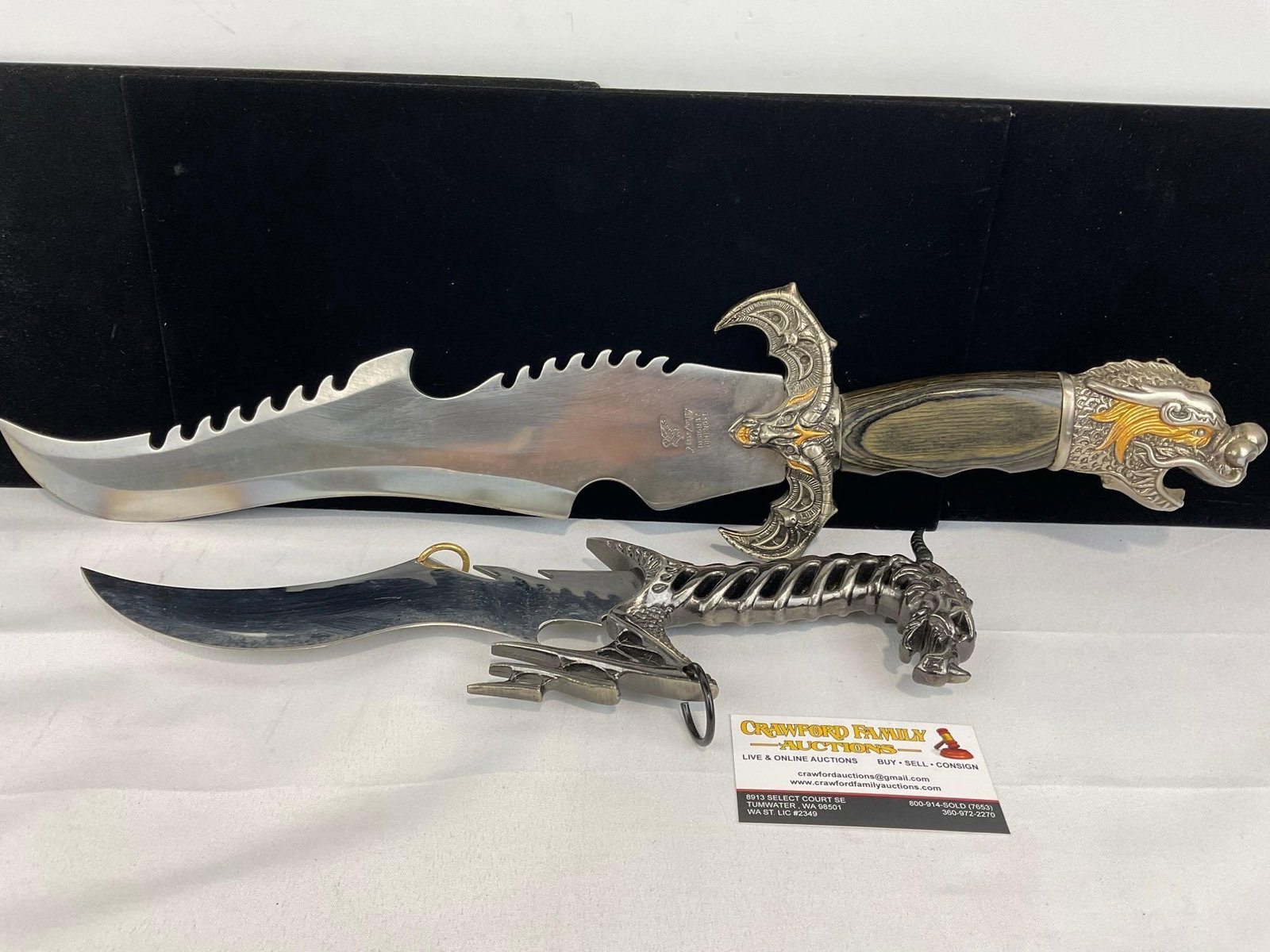 2 Large Fantasy Knives, 1 Frost Cutlery, Wood & Carved metal Handle, & Knife w/Dragon style Handle: Appears to be in good shape. The piece measures approx 23h x 6w x 4d inches. See pics. E-5940